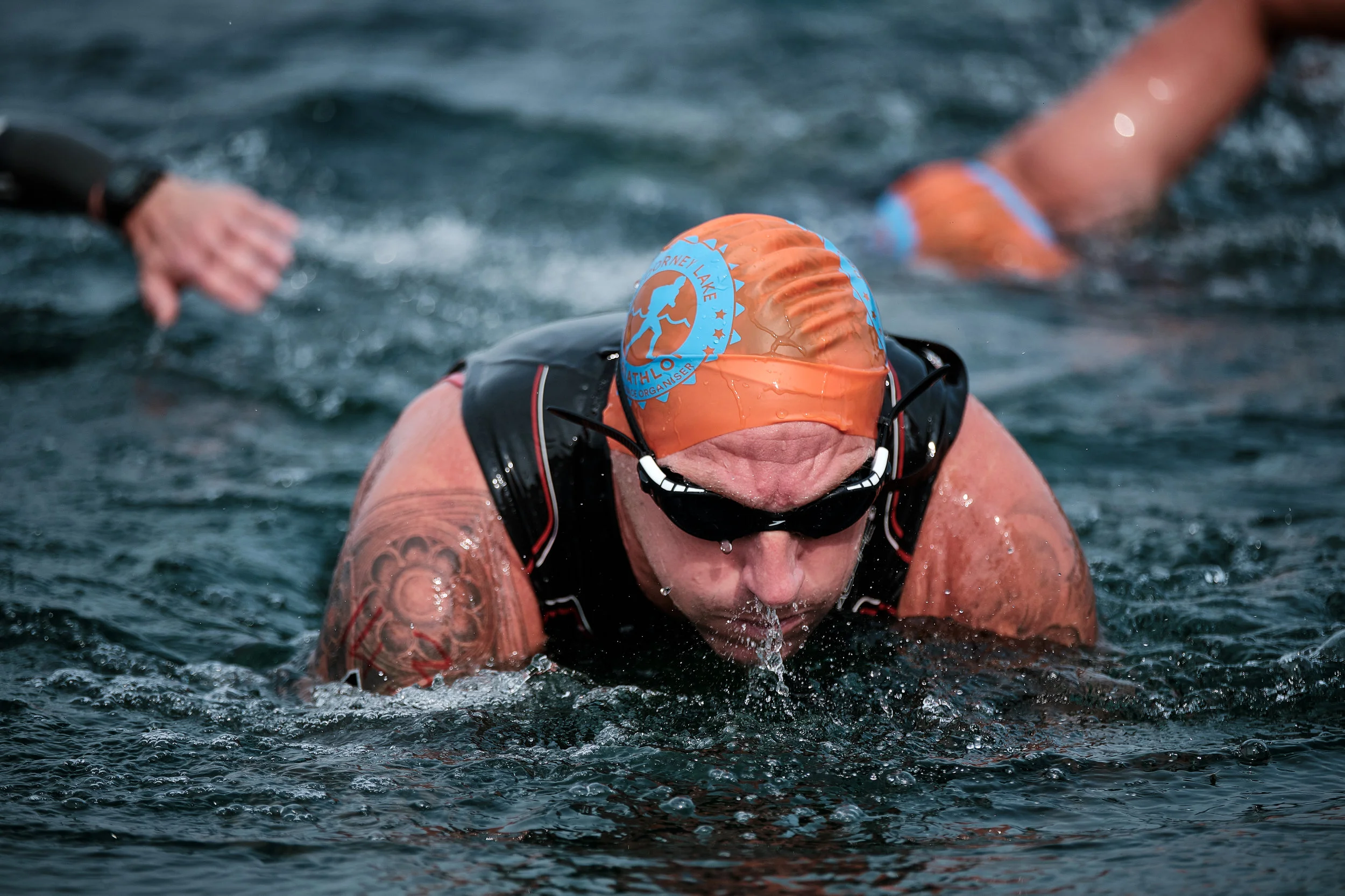 Triathlon from “The Race Organisers”, Sunday 4th August 2019, Dorney lake, UK. First competitors of the Man’s wave start to emerge from the Dorney lake.