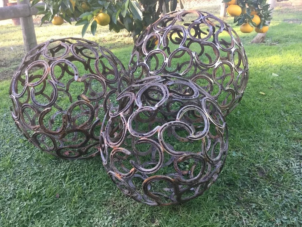 Horseshoe Balls or Spheres crafted from upcycled horseshoes 