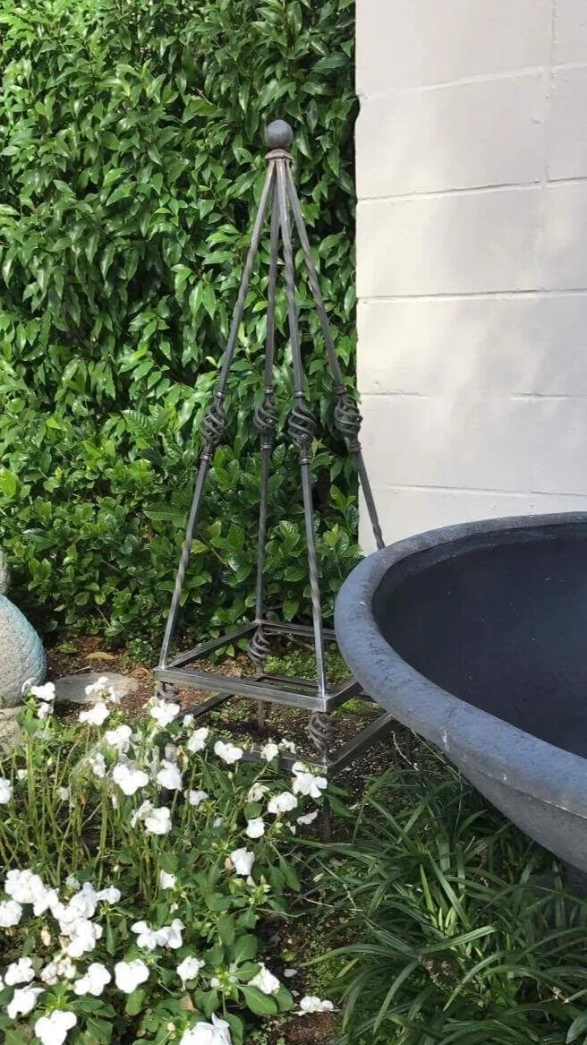 OBELISK - HANDCRAFTED. DECORATIVE. A REAL STATEMENT PIECE LEFT WITHOUT PLANTING  OR STUNNING WITH A ROSE TWISTING THROUGH IT. 