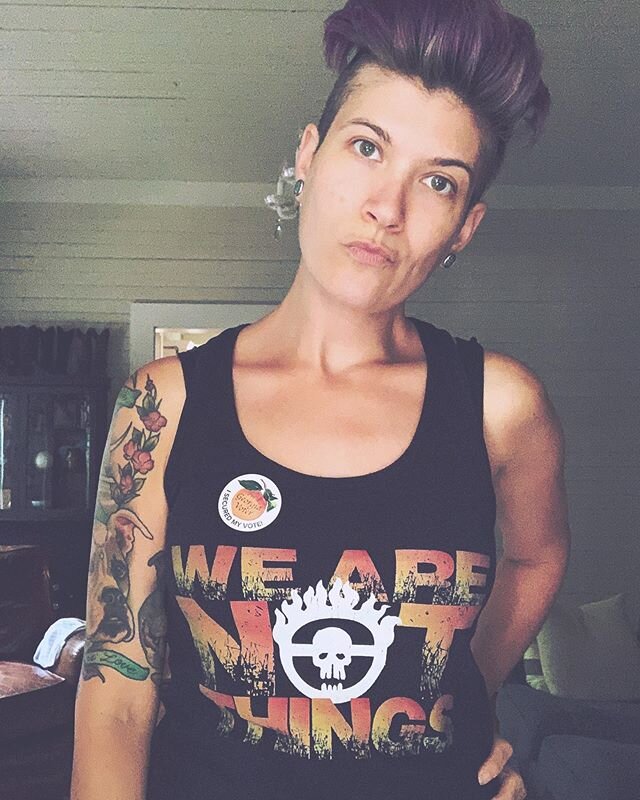 I wear this shirt every time I vote. (Oh btw I shaved 1/3 of my hair off.) (And my left shoulder smells like baby puke most of the time.) (Also still on the anti-racist grind.)