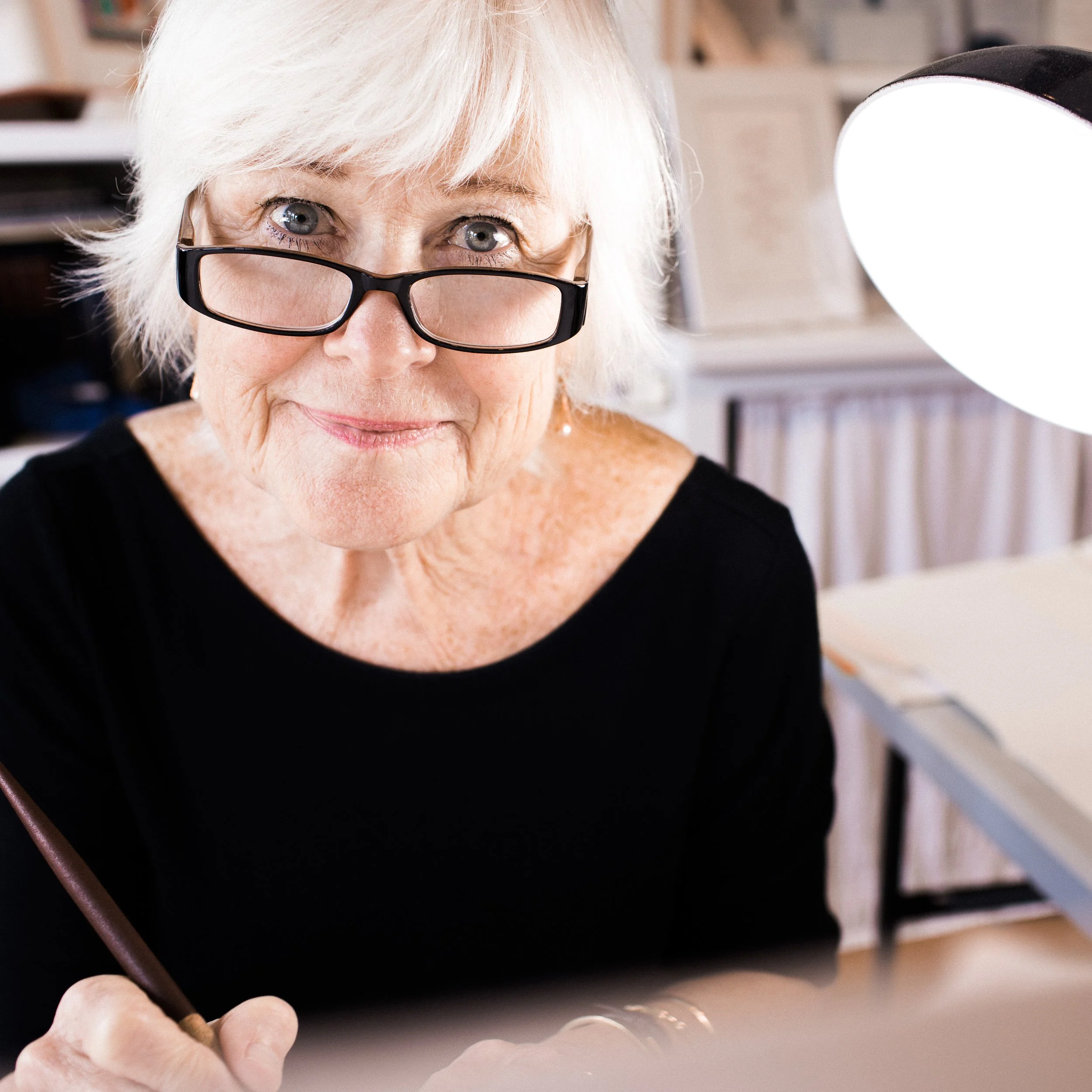 Caligrapher at her desk for a portrait by Fil Nenna on Boston's North Shore