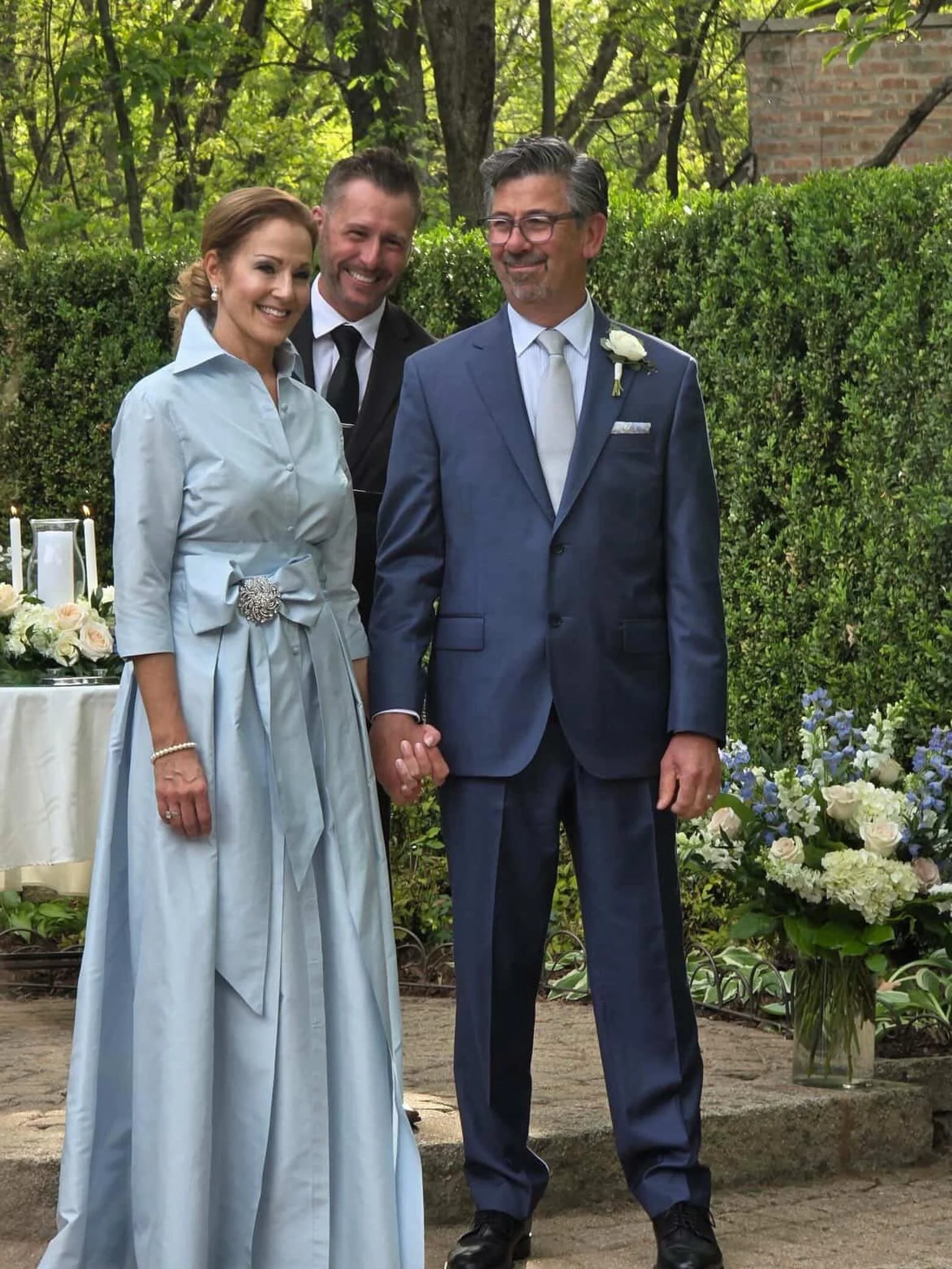 mother-of-the-groom glowing in blushed blue! we love how she accented her belt with a crystal brooch for a personal touch. beyond beautiful! #LucianaEmilia