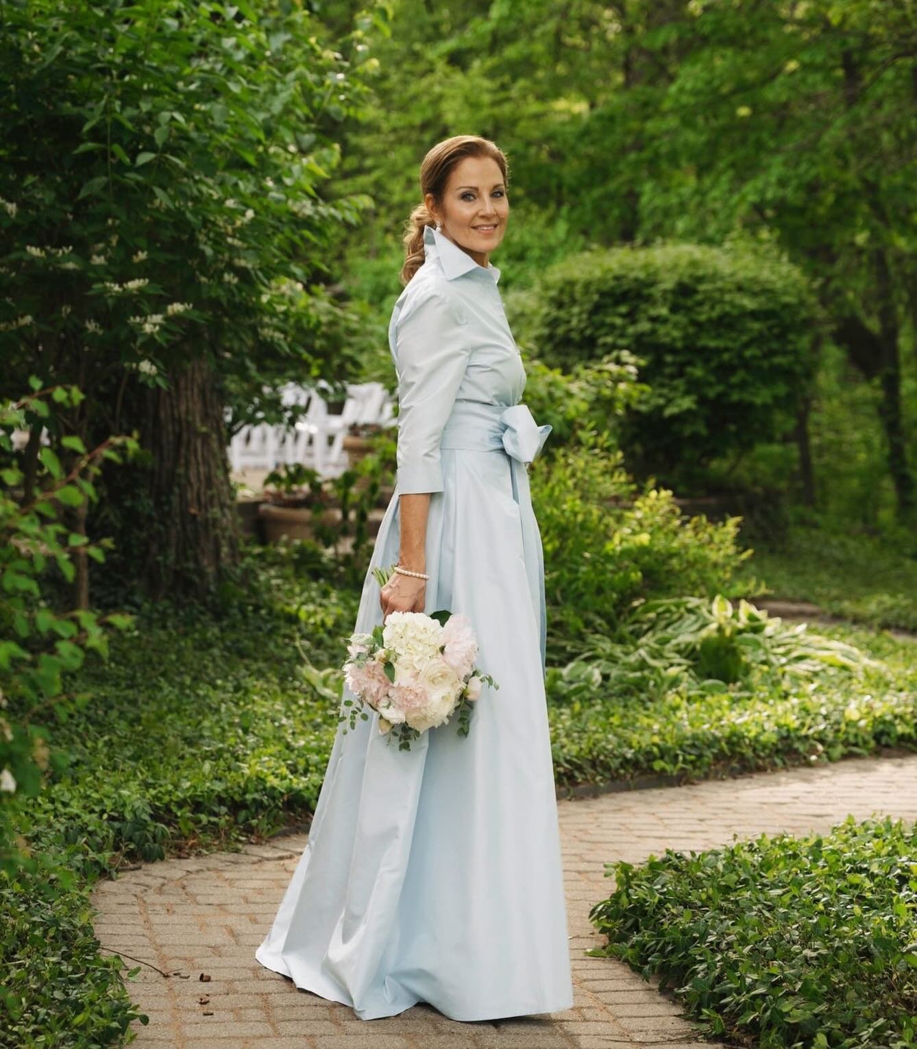 gracefully stepping into one of life&rsquo;s most meaningful moments in our Blushed Blue Effortlessly Elegant gown. #LucianaEmilia