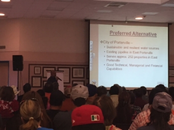A meeting of community members in East Porterville. DWR explains its plan for connecting ~1000 households on private wells, without running water, to the nearby City of Porterville. June 2016. Photo by A. Fencl