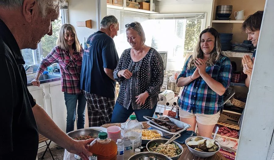 Work party participants get ready to feast after a good day's work.