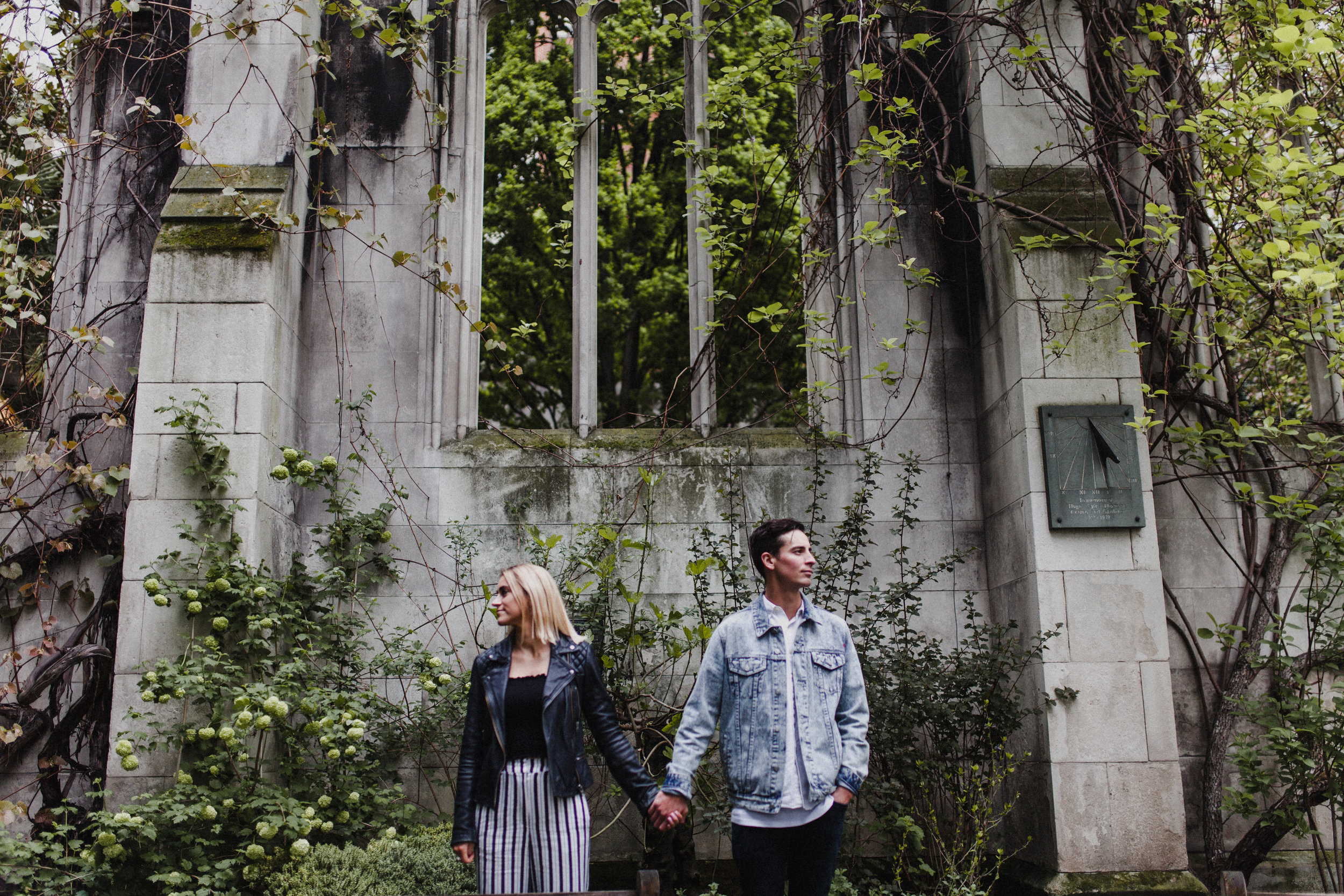 Couple pose for a portrait in the grounds of St Dunstan-in-the-East, a ruined church in London