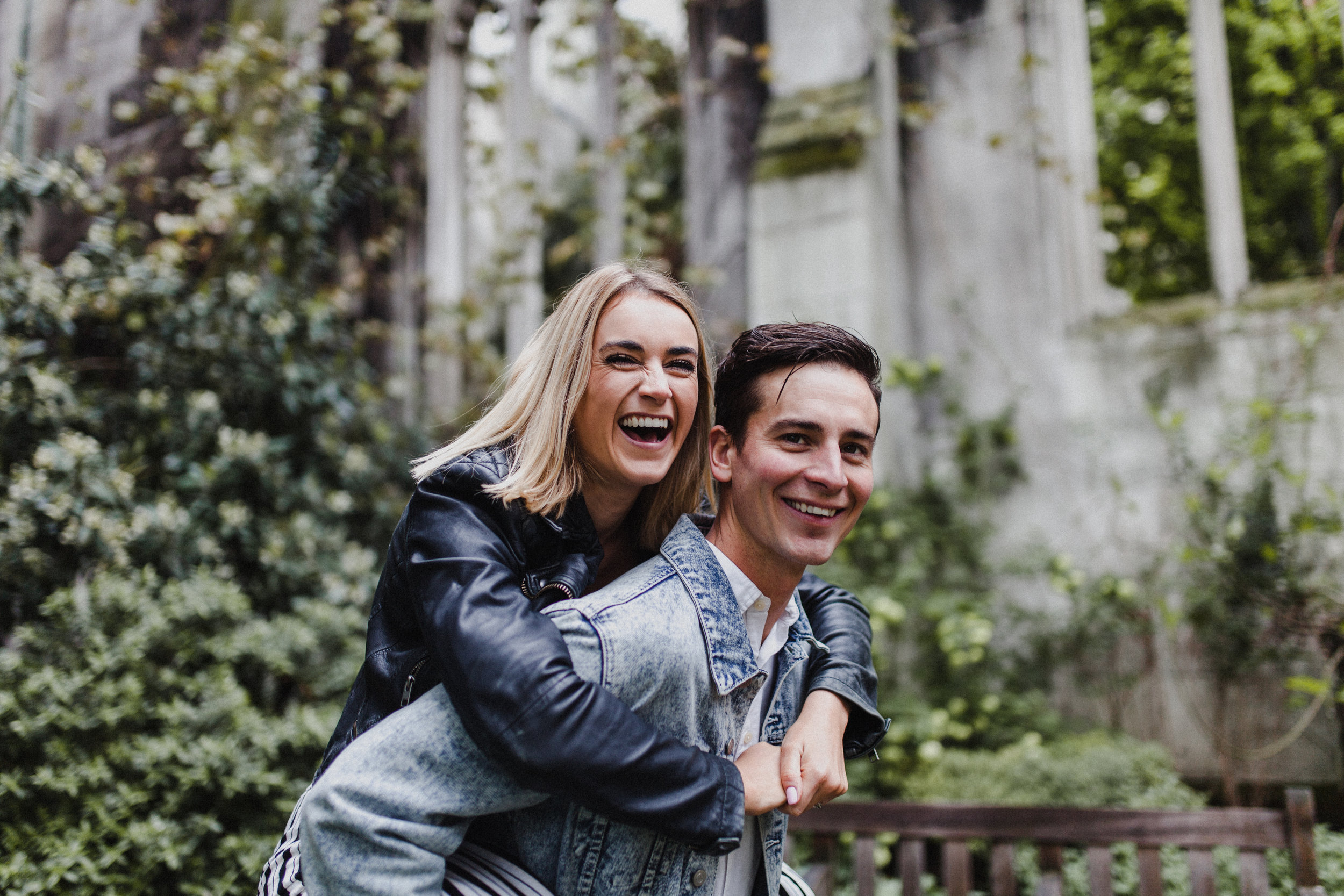 Fun pre-wedding portrait of the couple laughing.