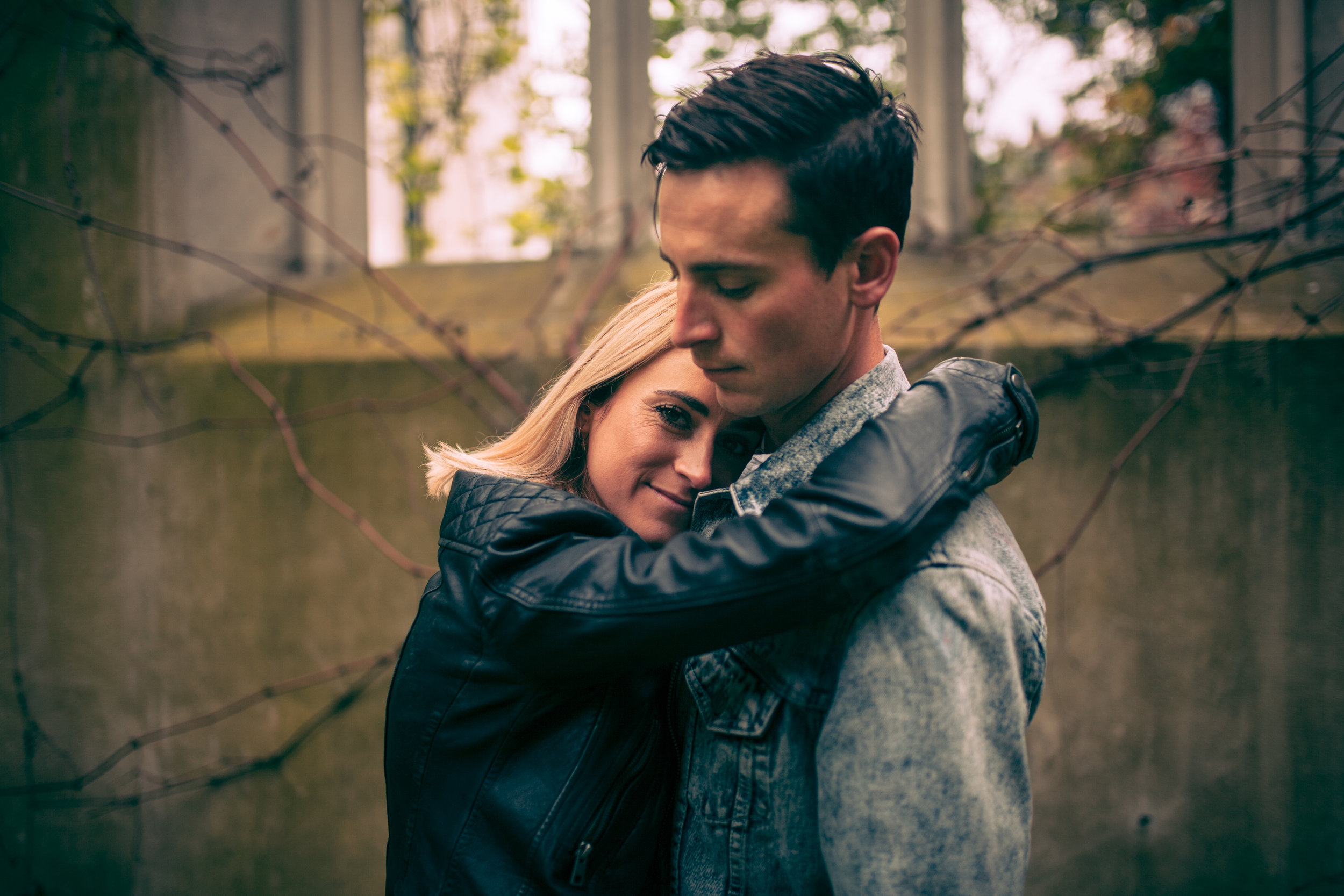 A Natural style portrait of the couple having a moment together in the grounds of St Dunstan-in-the-East