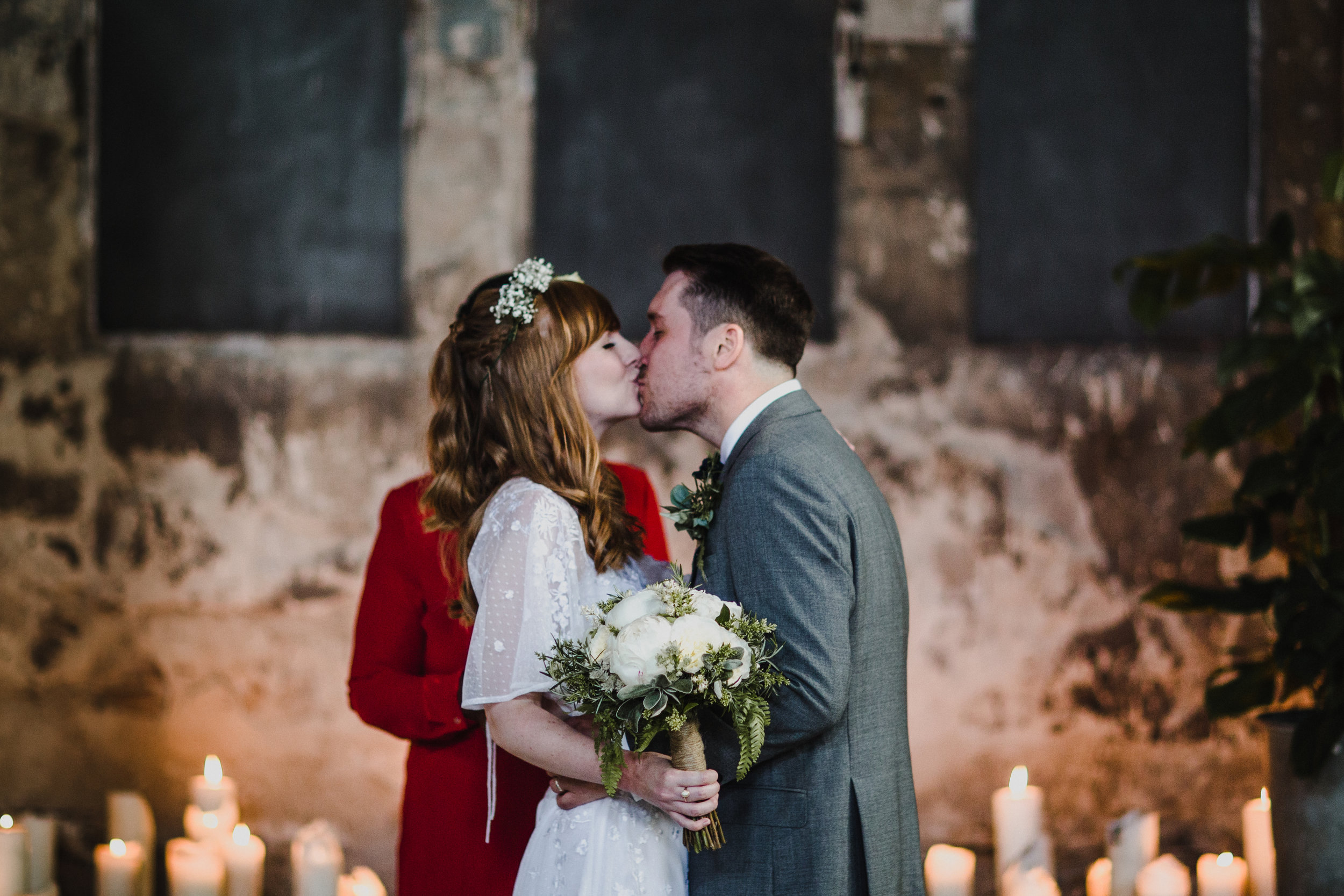 Bride and groom kiss at the end of the marriage ceremony.