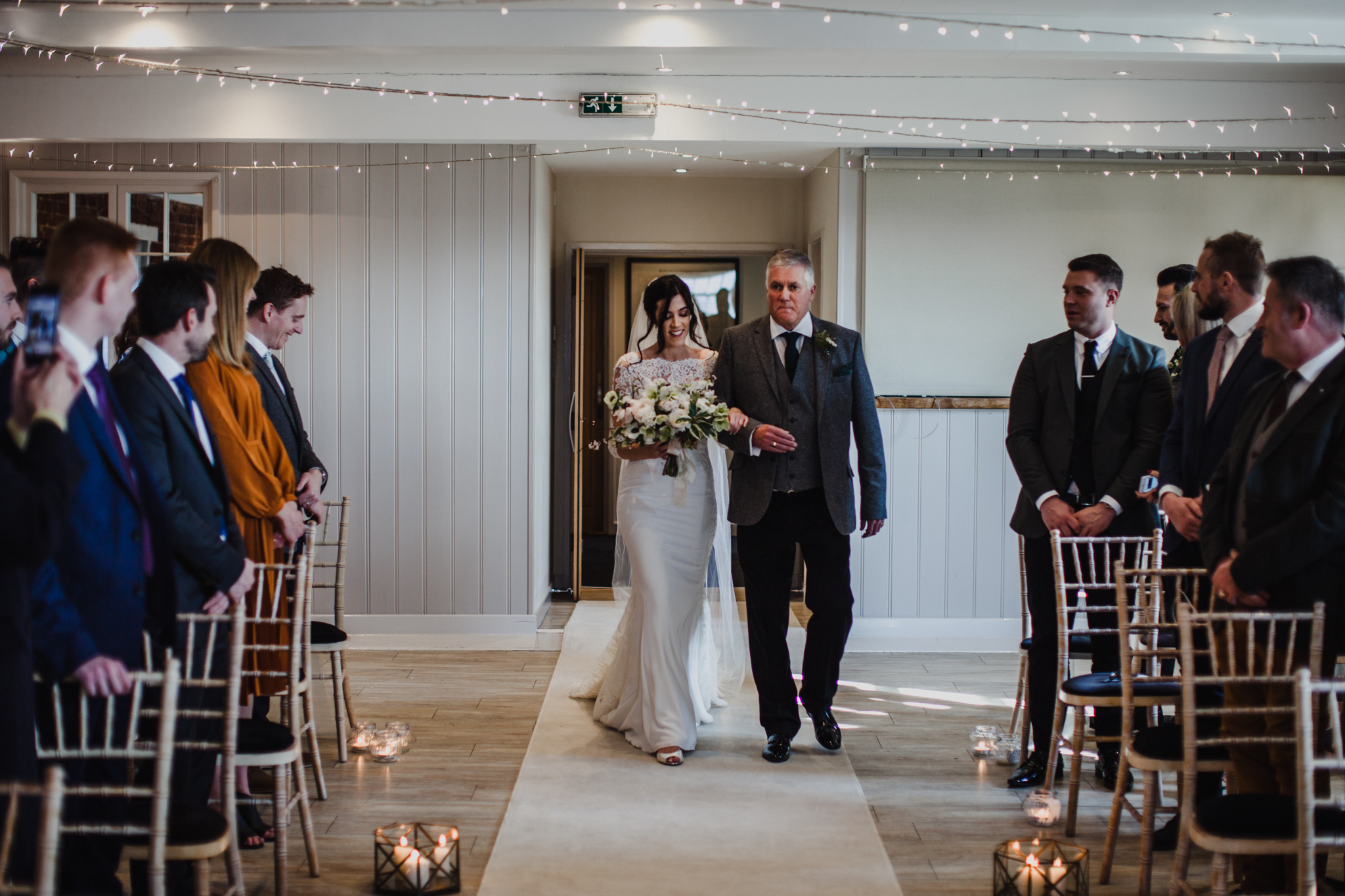 Bride and father of the bride walking down the aisle