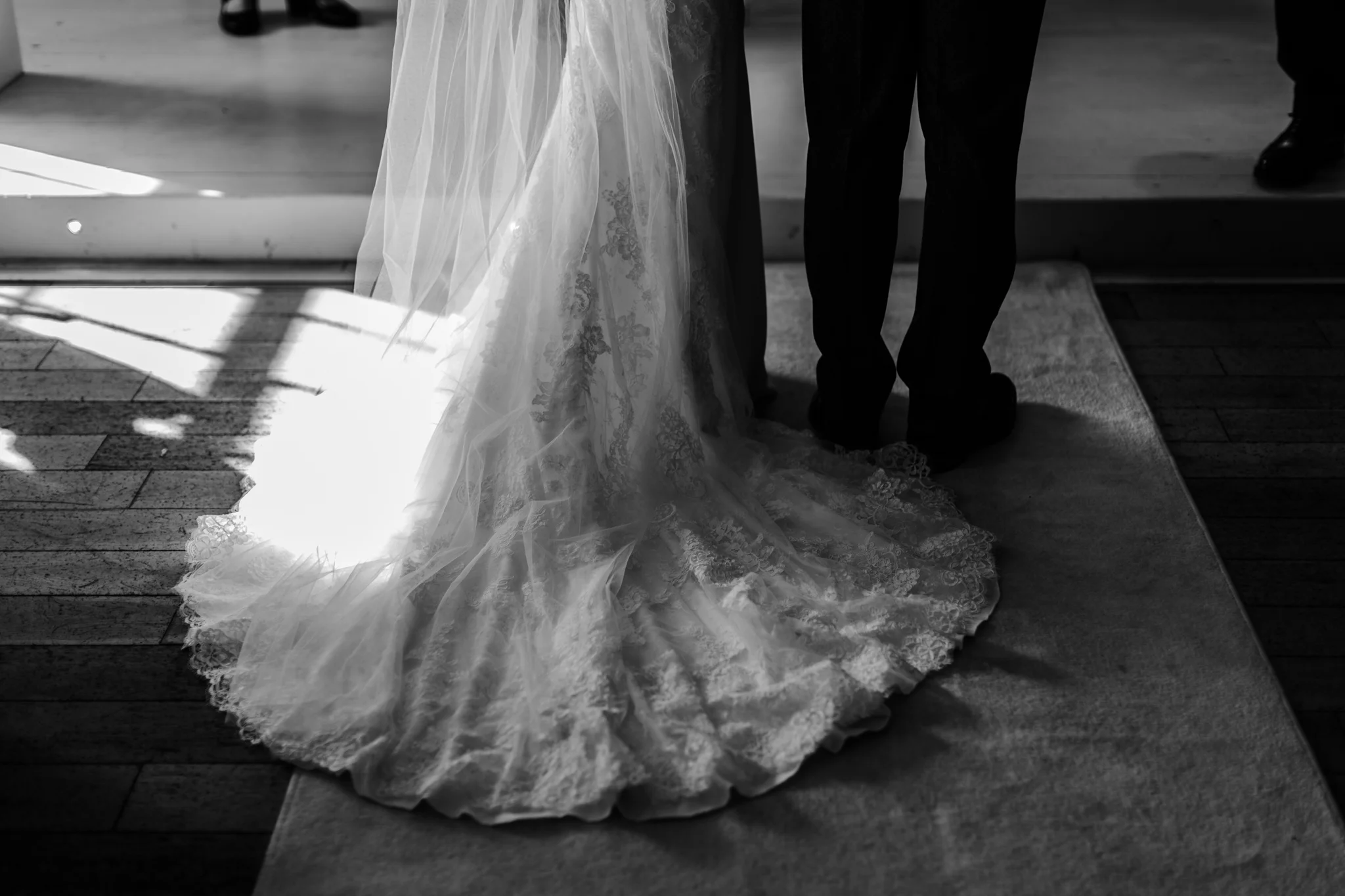 Detail of wedding dress and suit