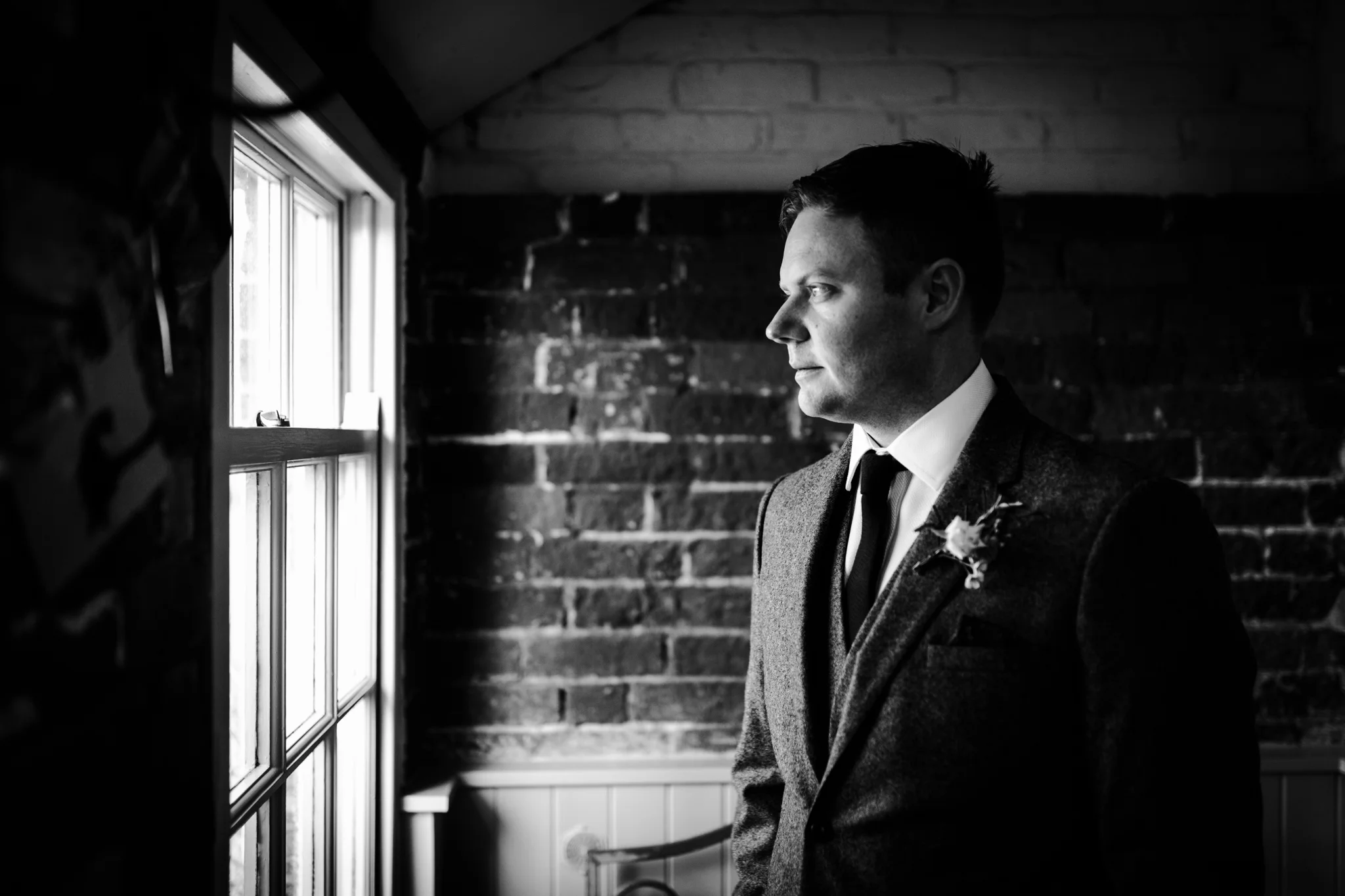 Groom gazing out the window