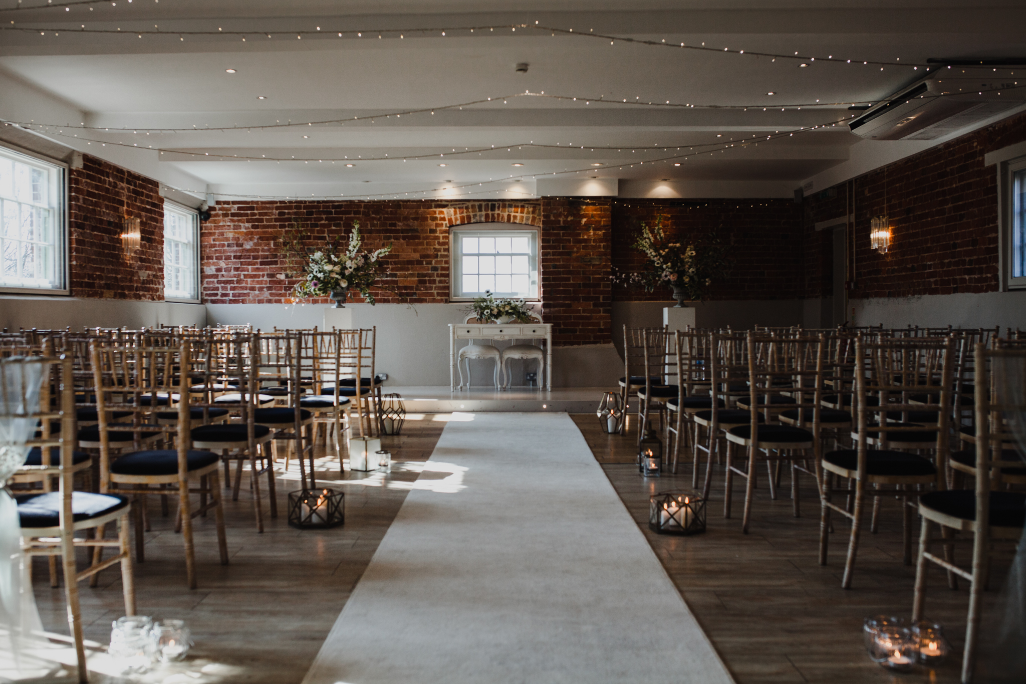 The ceremony room filled with chairs at Sopley Mill
