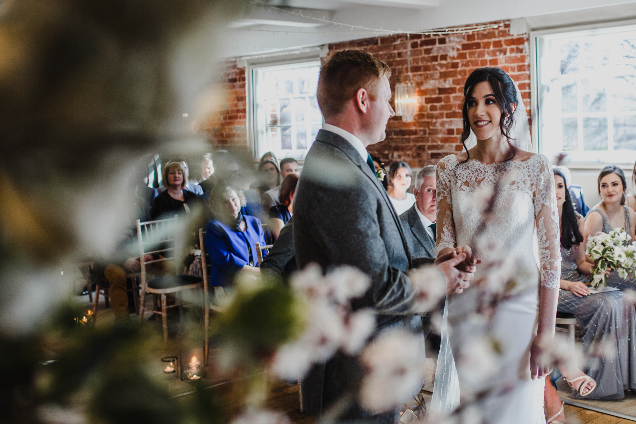 Image of bride and groom through theFlowers 