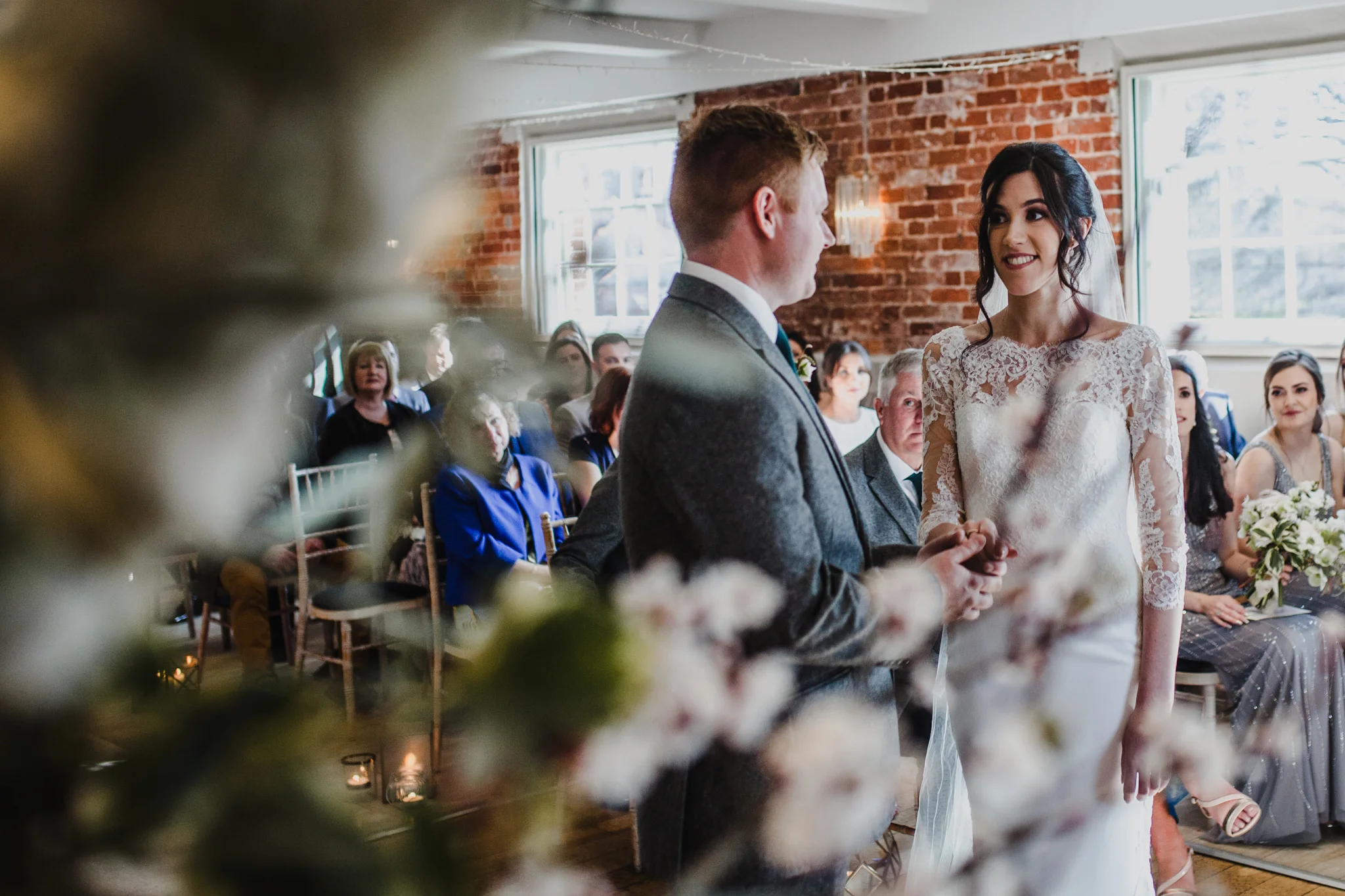 Image of bride and groom through theFlowers