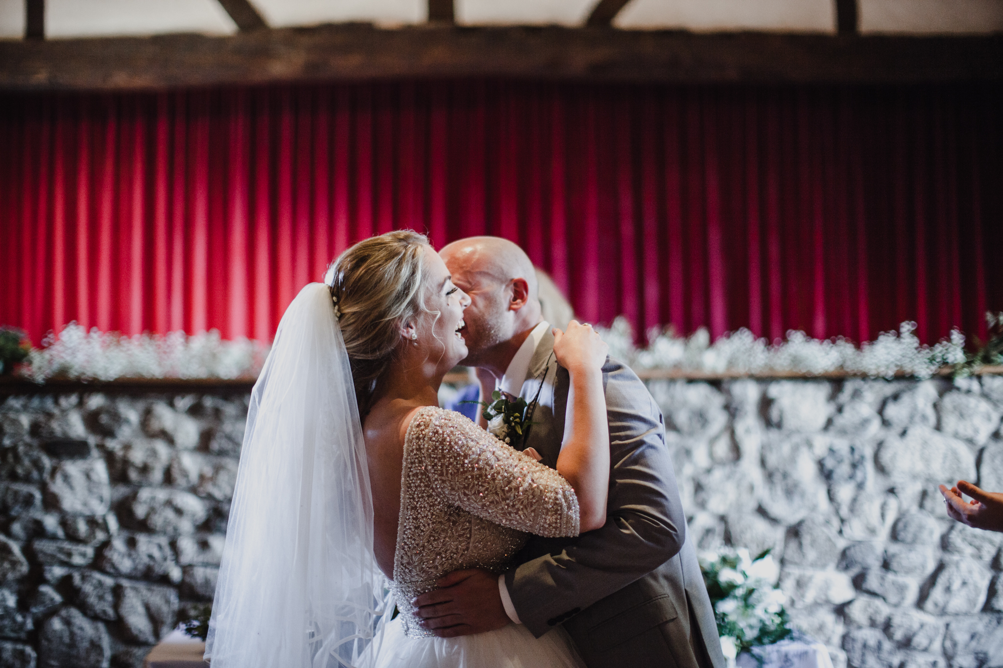 Bride and groom laughing after saying their vows