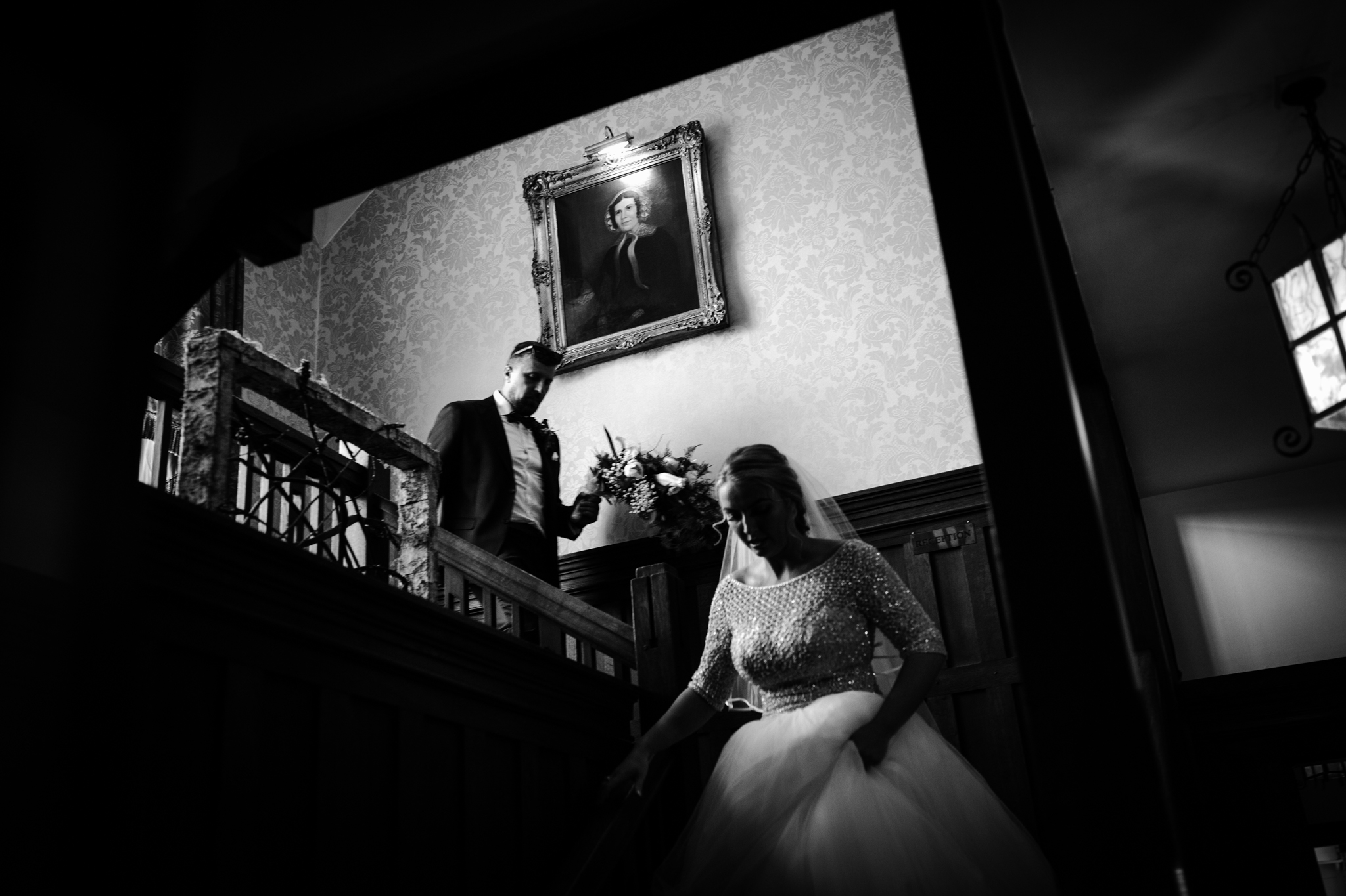 bride and her father walking down the stairs before the wedding