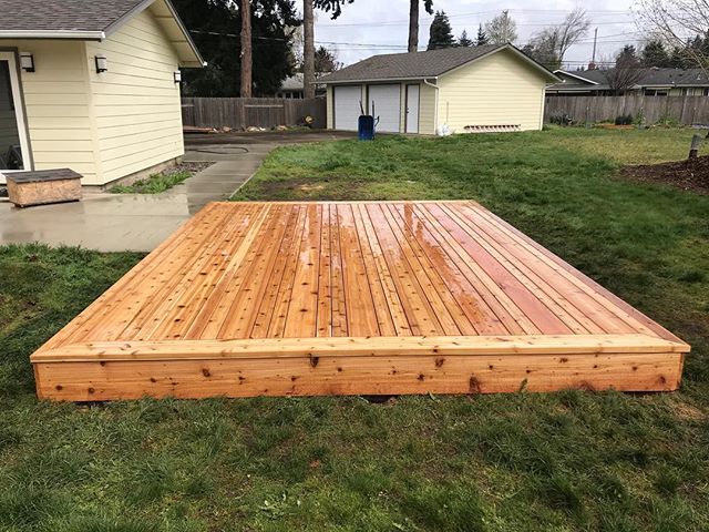 The clients wanted a little cedar platform in their backyard.  So we built this for them out of Western Red Cedar tight knot with 2x4 and 2x8 pattern. #decks #cedar #workhorsebuilt