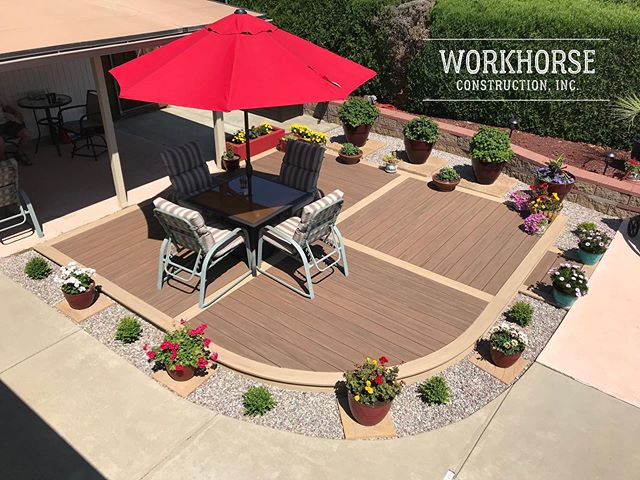 The landscaping is finally finished on this fun little curved deck. We used AZEK Vintage English Walnut with Weathered Teak accents. #azek #azekdecking #decks #workhorsebuilt #oregon