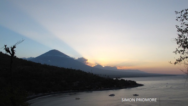 The attractions of geotourism in Bali is clear: mountainous spine of Mts Agung, Abang and Batur stand tall and beyond that Mt Batukaru in the hazy distance.