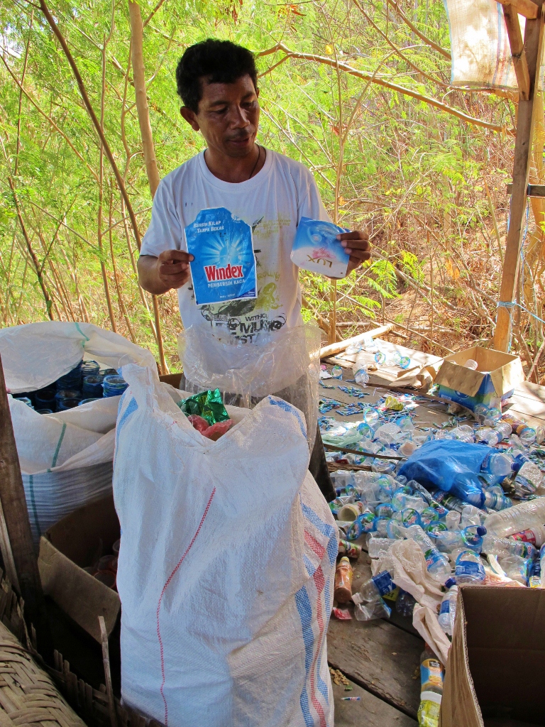 Papa Joe sorts plastics. Photo by Sam Tyers.