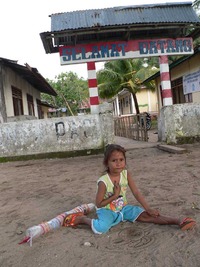 Sand play outside her school.