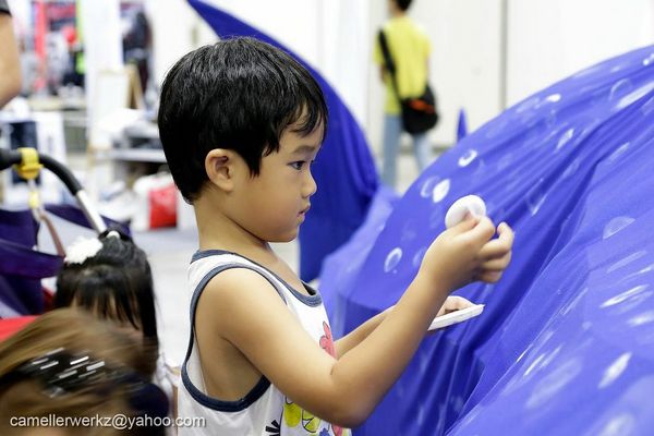 Every whale shark is unique, and this kid adds to its special "star patterns" that are used in researching this species.