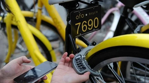 Riders download a smartphone app which links to an attached GPS tracker and the bicycle lock. Courtesy of ChinaFoto.