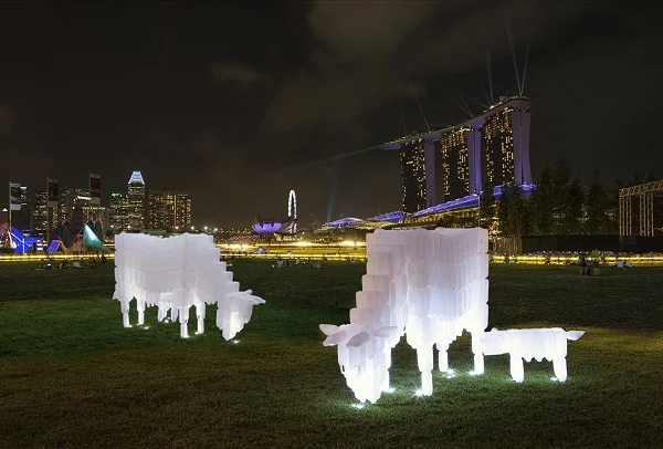 BP Loh's plastic milk bottle cows on display at i Light Marina Bay 2018 aims to promote trash re-use and upcycle messages. Image courtesy of BP Loh.
