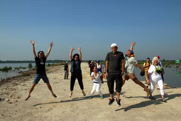 Musicians and media members at RWMF leap with joy for helping conserve Kuching Wetland National Park.