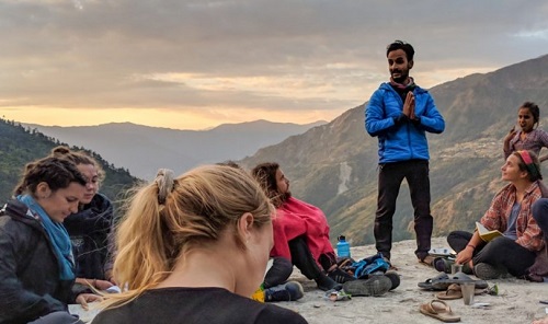 Rishi continues the work of helping bridge the understanding gap with a group of young overseas visitors. Courtesy Learning Service.