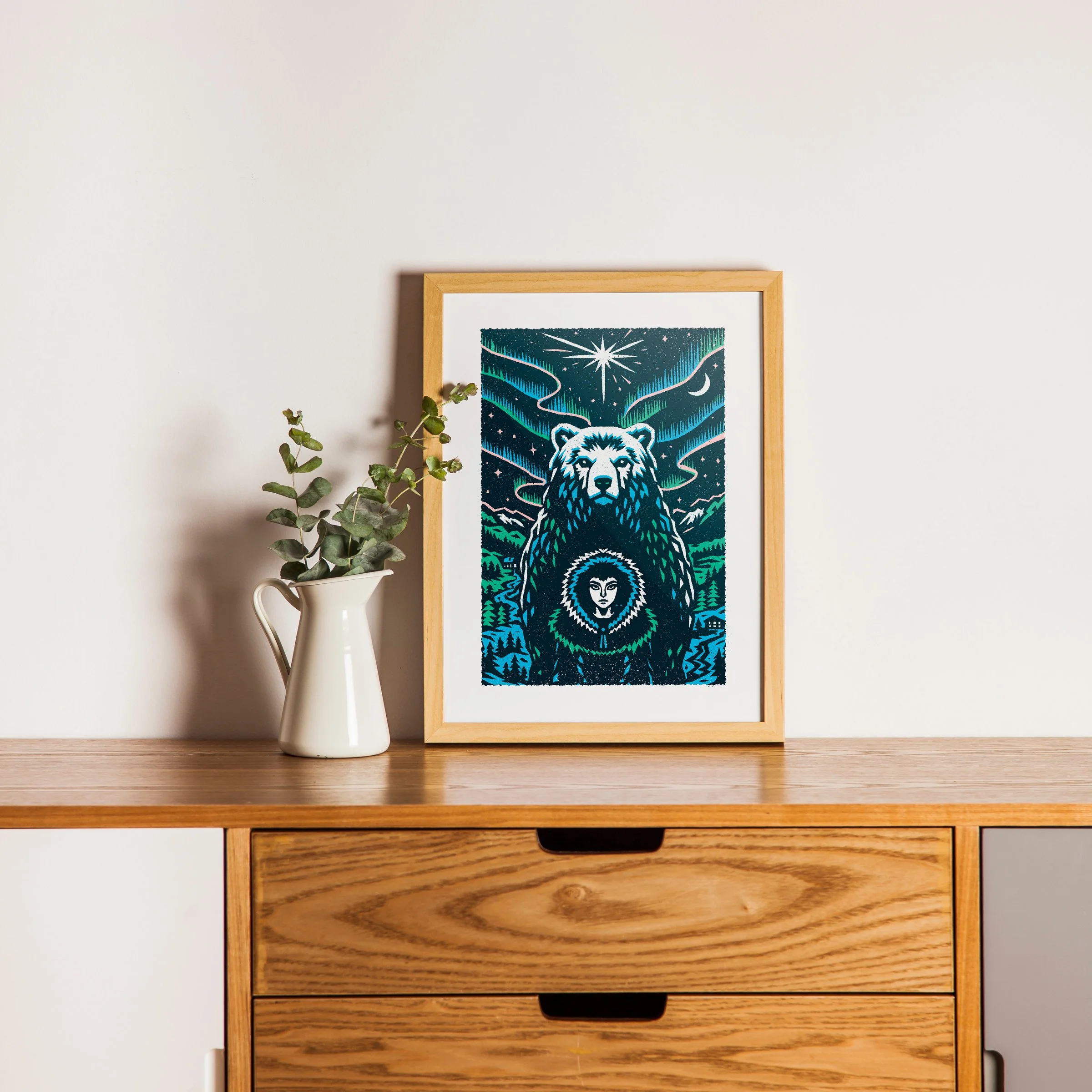 Between Worlds - Northern Bear Art Print, shown in a oak frame above an oak cabinet. Print supplied unframed.