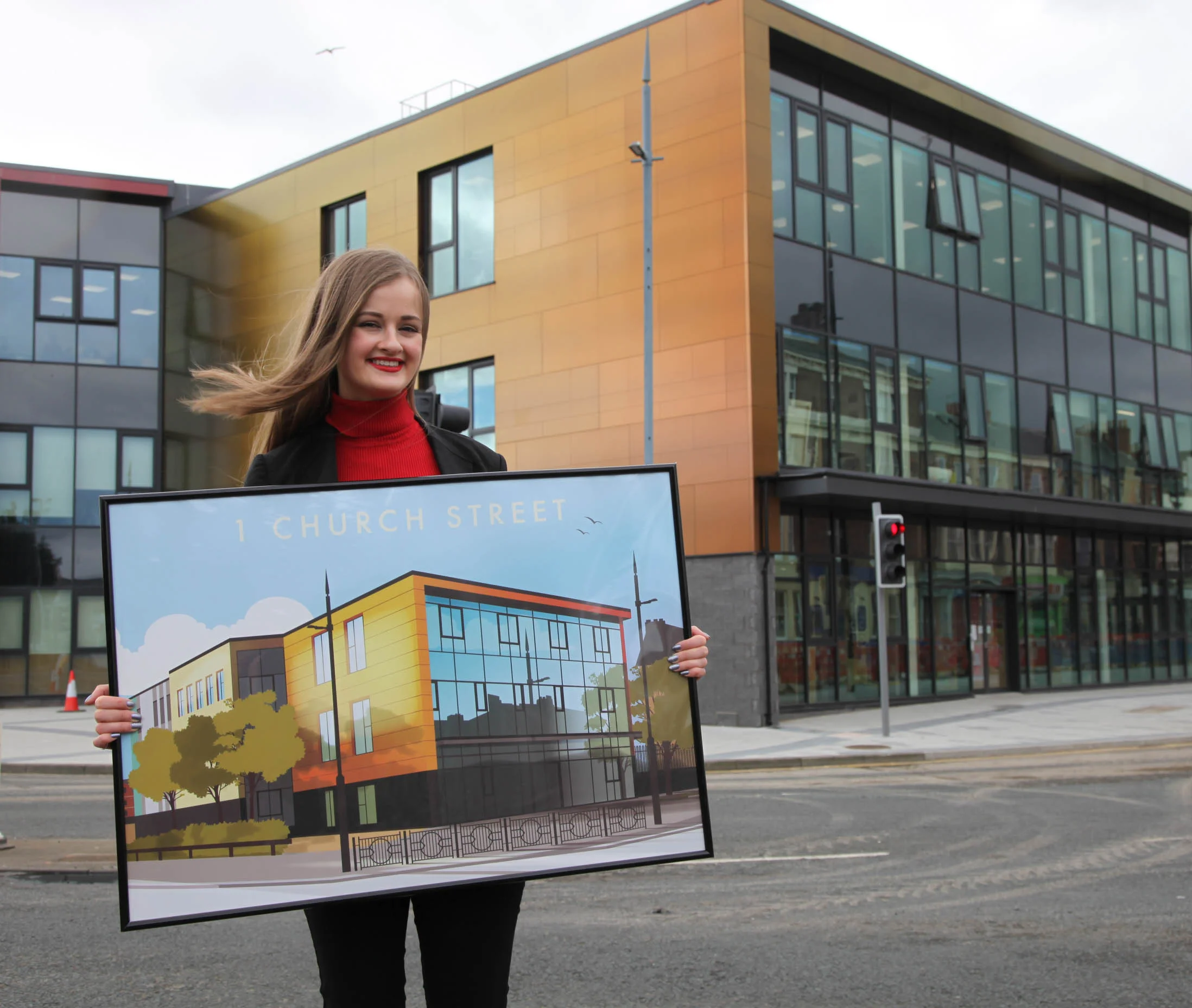 Abby Taylor with her vintage-style illustration of 1 Church Street which now hangs proudly at CCAD