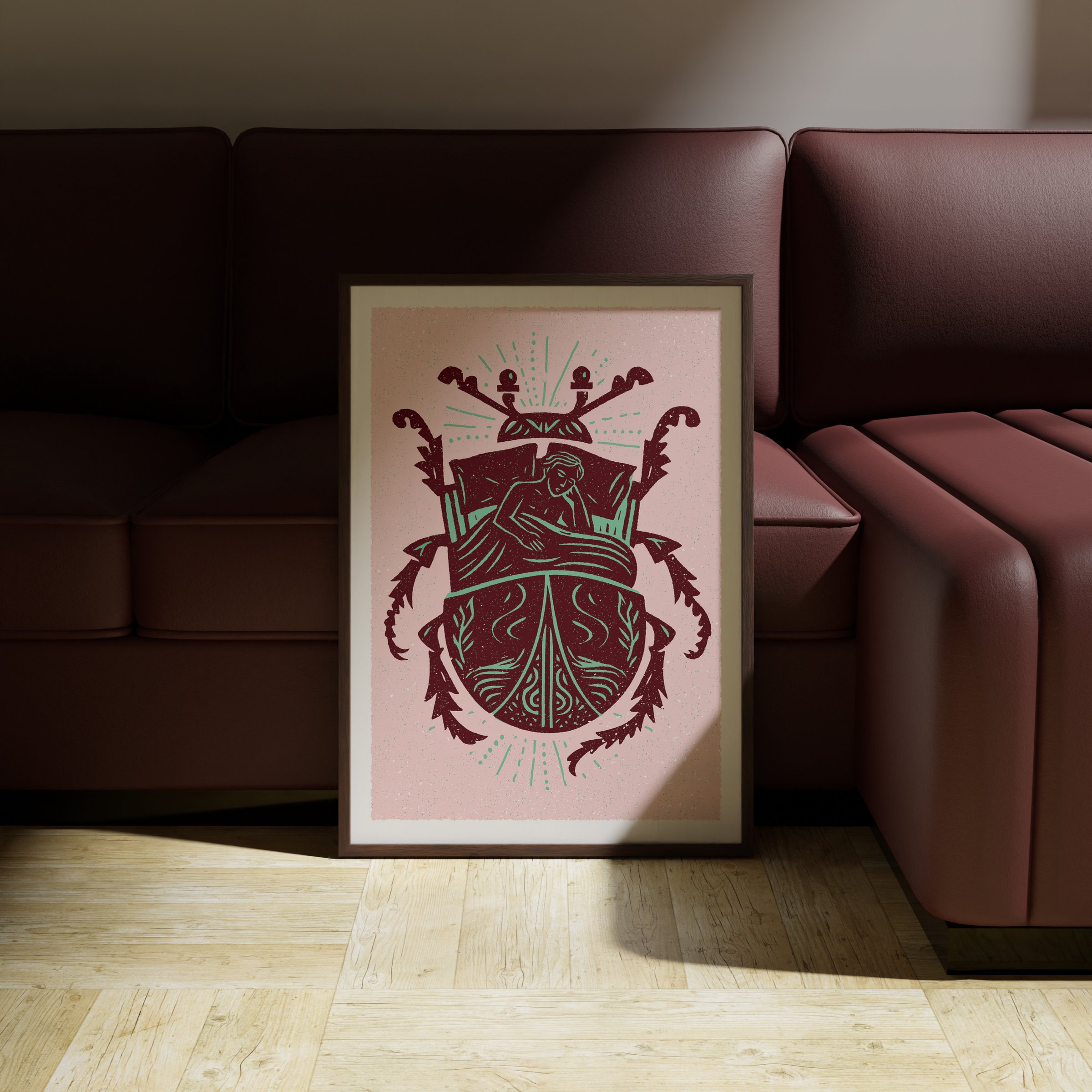 Waking Changed - Metamorphosis Beetle Art Print, shown in a dark frame above a warm sofa. Print supplied unframed.