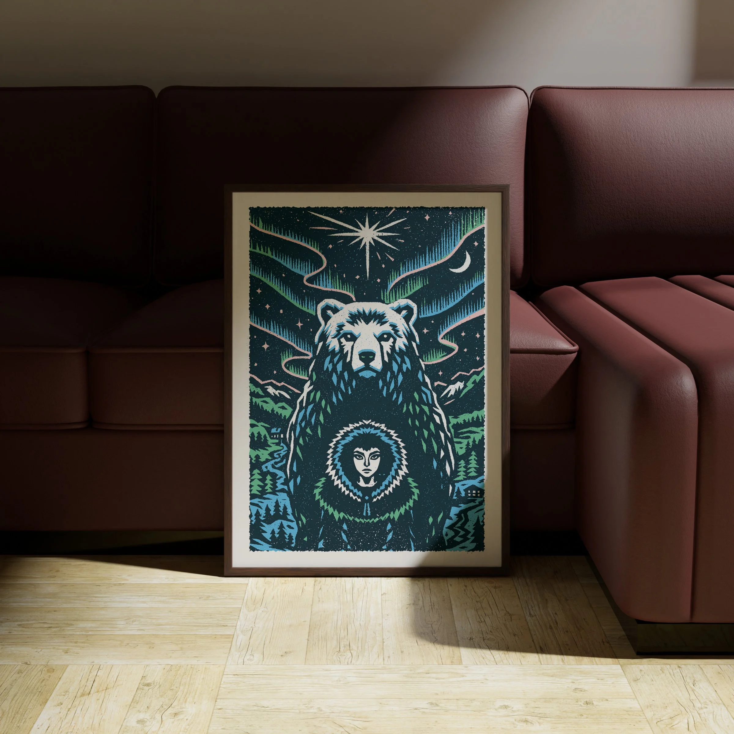 Between Worlds - Northern Bear Art Print, shown in a dark frame above a warm sofa. Print supplied unframed.