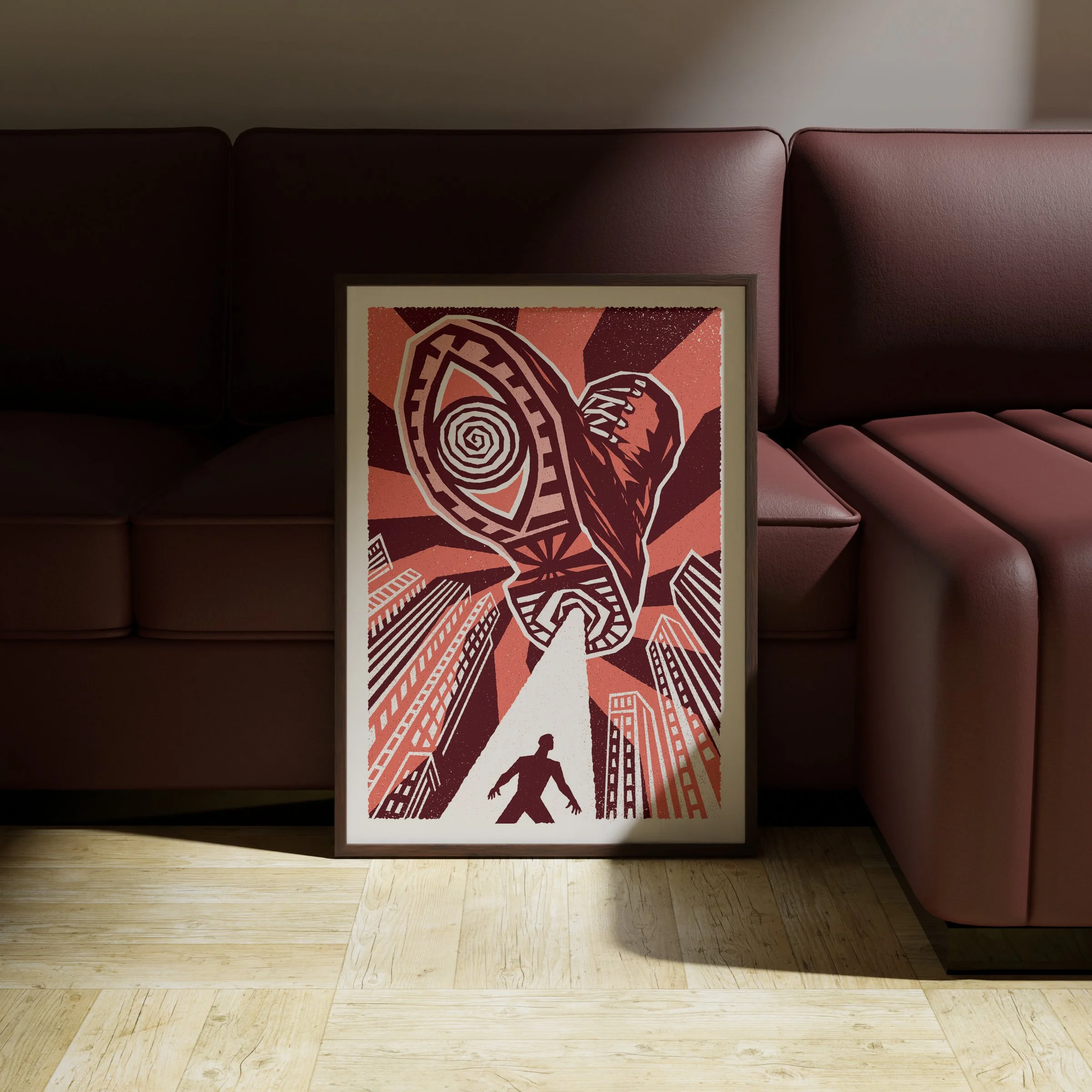 He’s Watching - Watchful Eye Art Print, shown in a dark frame above a warm sofa. Print supplied unframed.