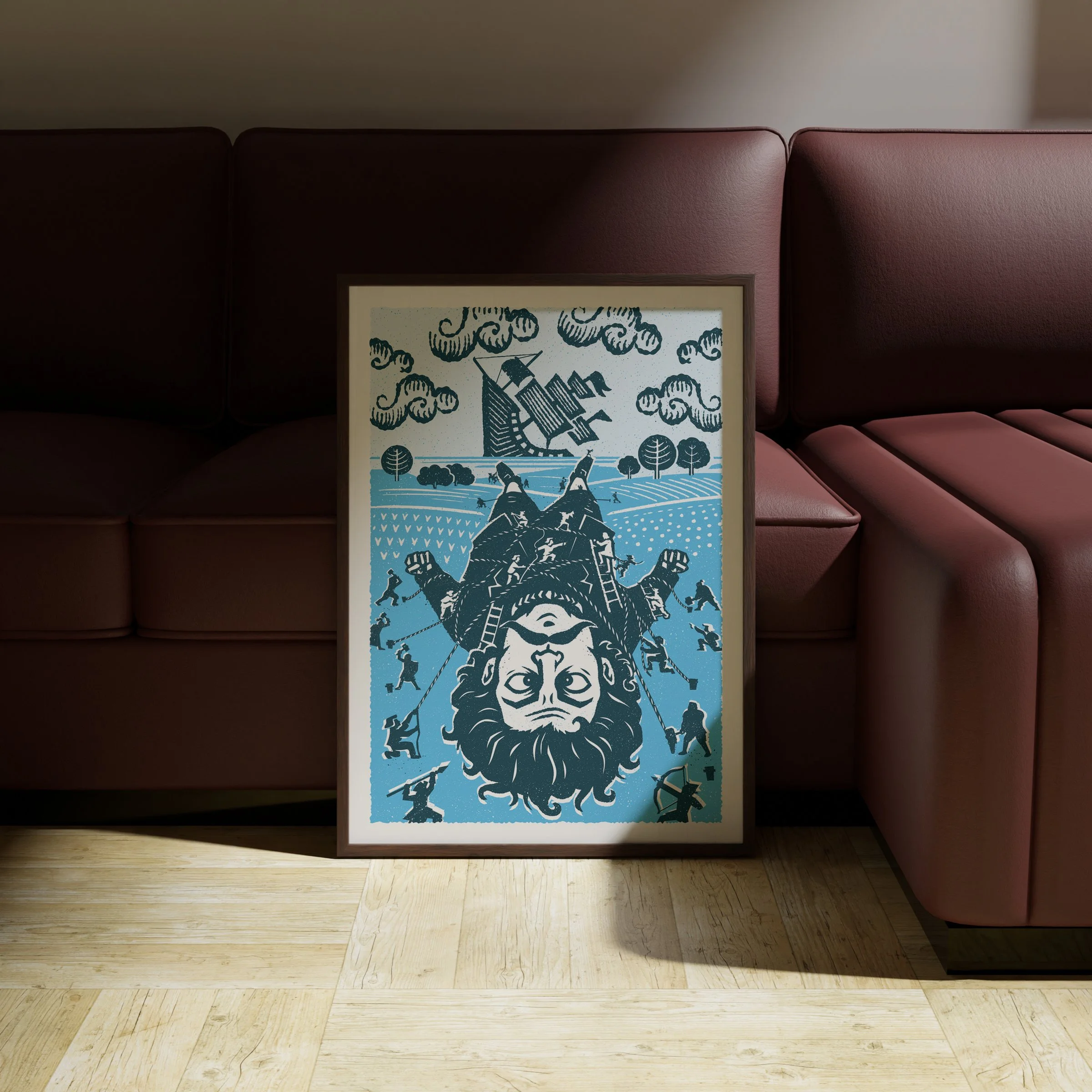A Matter of Scale - Gulliver Art Print, shown in a dark frame above a warm sofa. Print supplied unframed.