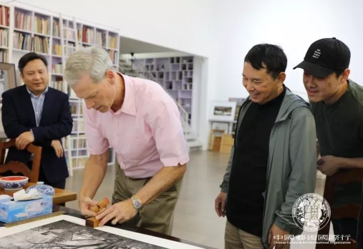 Mr. Steven C. Rockefeller Jr. signed and stamped on his photography work to Mr. Jiang Guofang