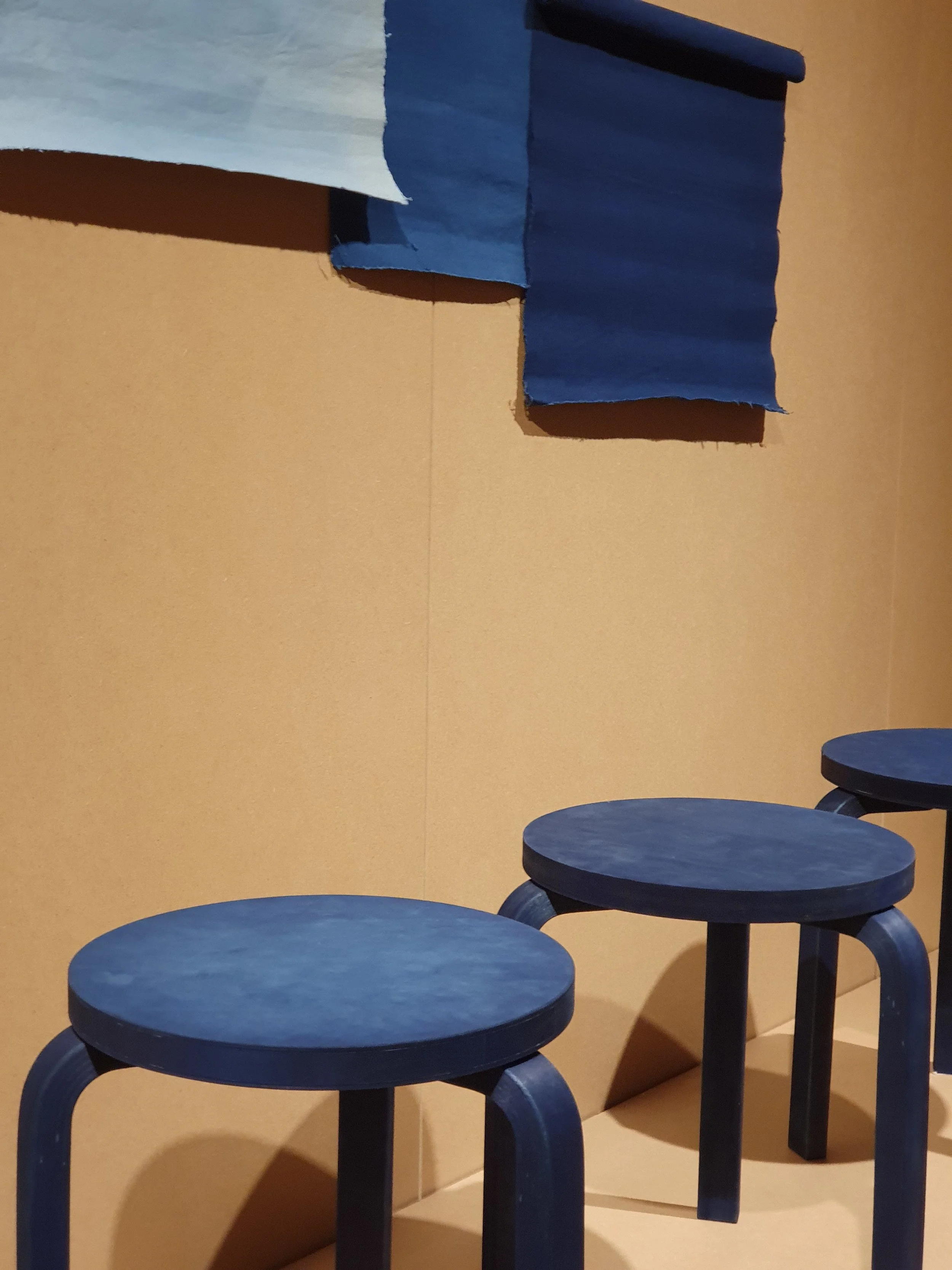“Stool 60 Aizome brings together Alvar Aalto’s iconic design with a traditional plant-based Japanese colouring technique. Indigo dyeing, or “aizome” in Japanese, is a popular process used to create denim and is now applied to turn the stool a characteristic deep blue. Often used in fashion and textile design, the tradition of indigo dyeing is deeply rooted in the Japanese conscious and the vibrant colour it produces is also known as “Japanese blue”. To create this version of Stool 60, Artek partnered with indigo-dye specialist BUAISOU from the Tokushima prefecture. The indigo they use is among the most difficult dyes to produce, highly prized for its beauty, depth of colour and resistance to running. Employing a technique known as “Jigoku date”, which translates as “producing hell”, wood lye, bran and shell-ash are mixed, before fermentation. Stool 60 is dipped in this indigo bath, resulting in a strongly pigmented, deep blue surface that still allows the natural grain of the wood to shine through.