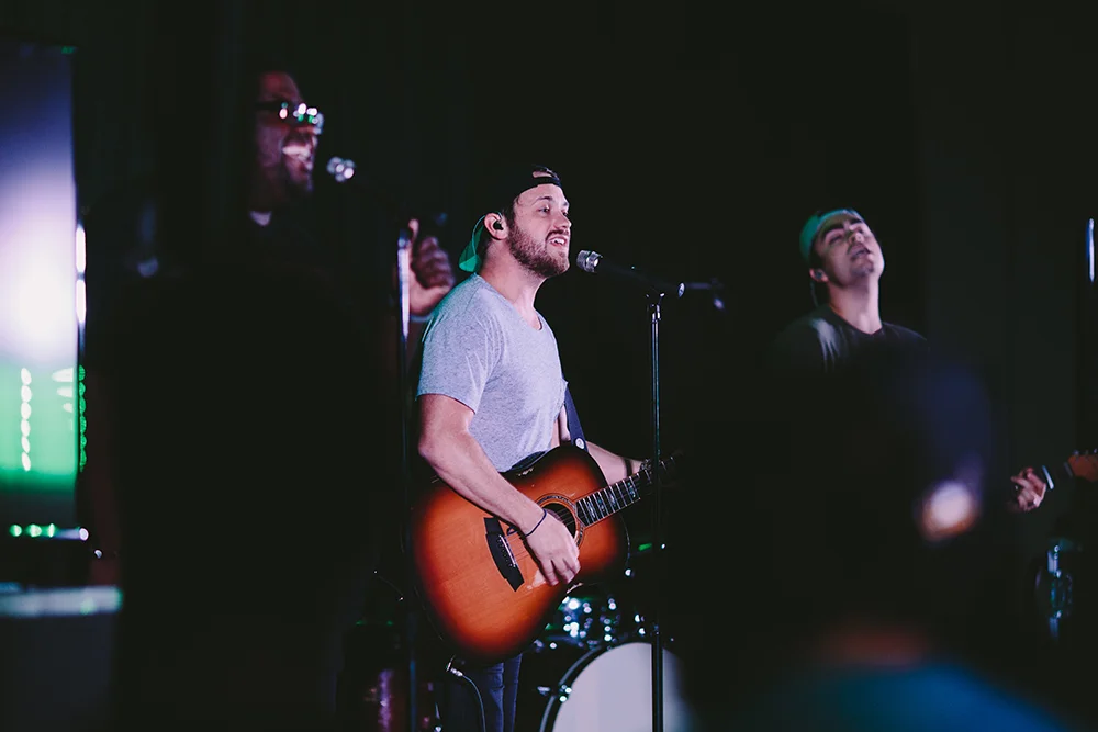 Chinua, Casey, and Paul leading worship.