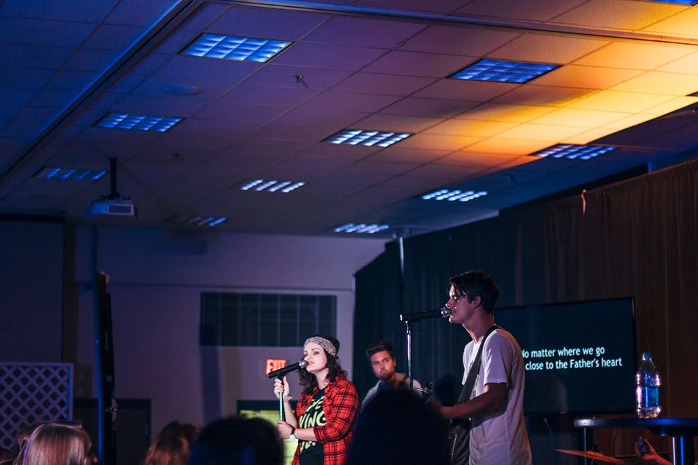 Dee Dee Westbrook + Brett Stanfill leading worship in the Student Center.