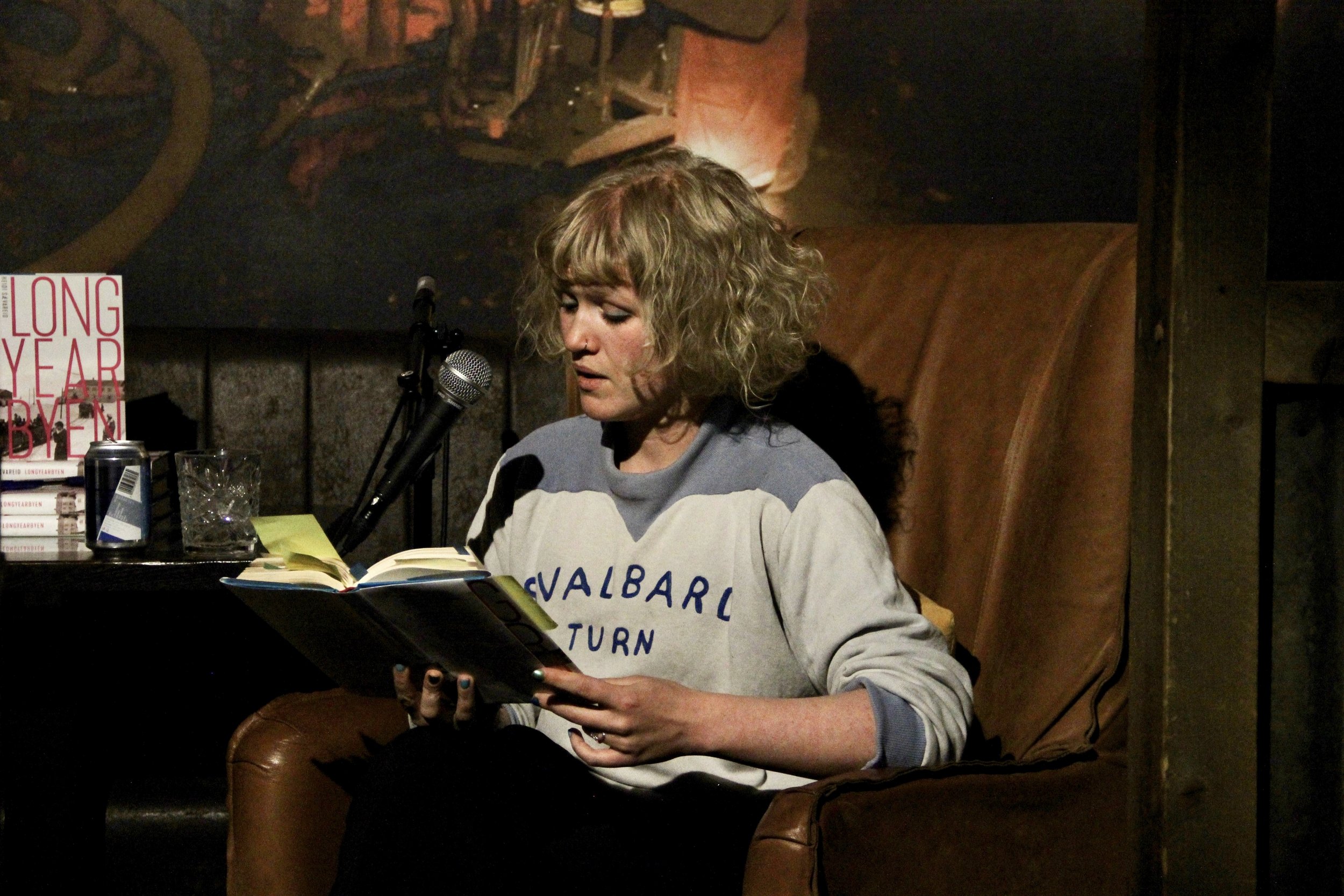 writer reading from book
