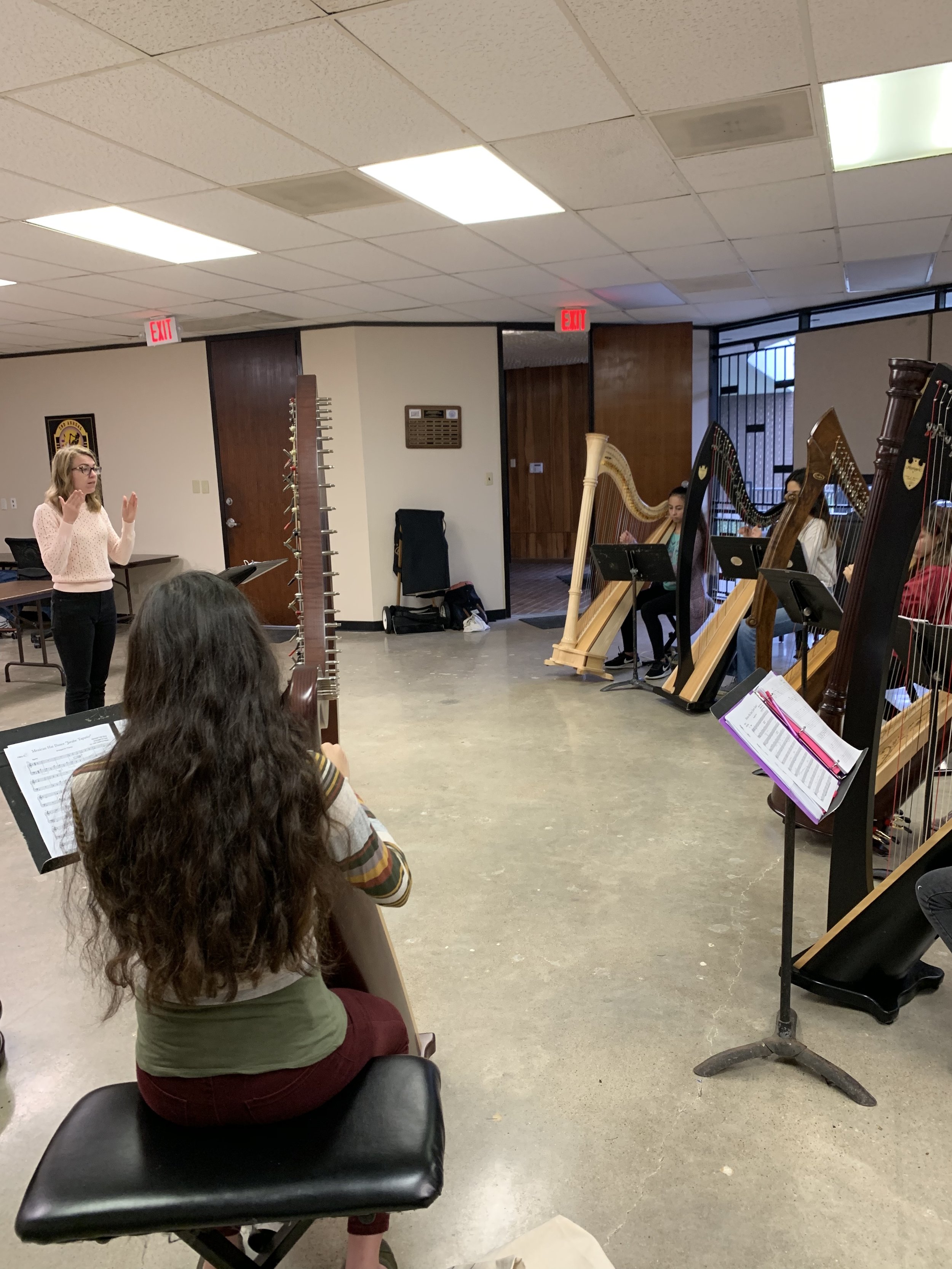  Stephanie conducting the Houston Youth Harp Ensemble 