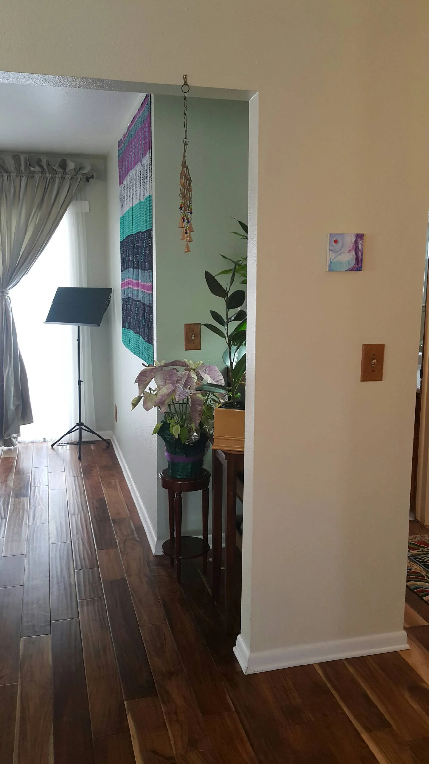 This is my music room....the painting and wall hanging brighten it up quite a bit. I did the painting way before I bought the wall hanging.
