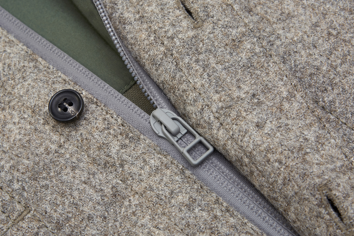 Melton wool shell sealed with Aquagard zip. Stops wind entering at the front.