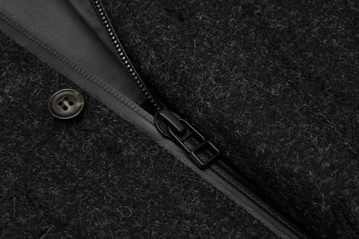 Melton wool shell sealed with Aquagard zip. Stops wind entering at the front.