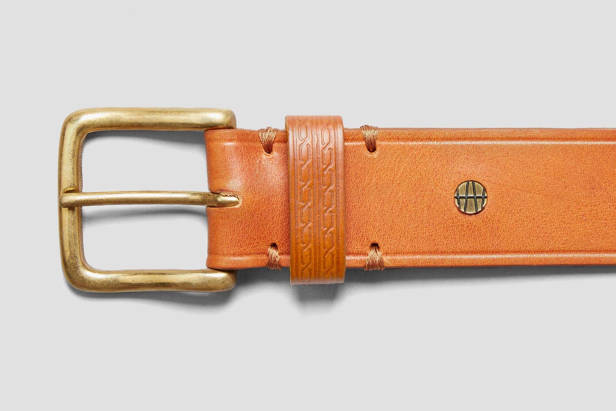Brass Buckle. Embossed belt loop. Made in London.