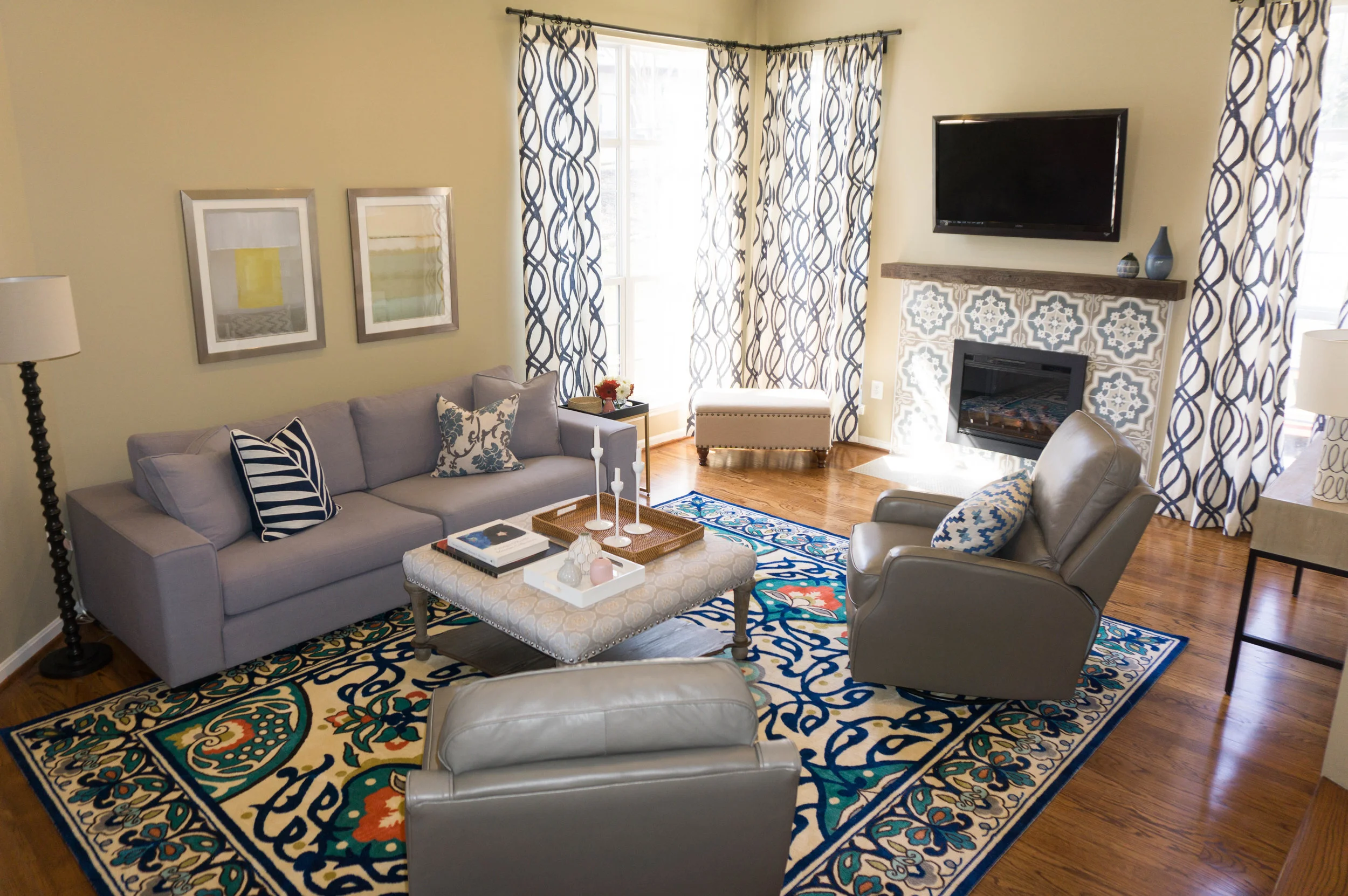 This sunken room prevously had an L shaped sectional blocking off the main entrance. I designed the space to include one couch and two floating swivel chairs so they wouldn't lose seating, but the flow of the room would become much more open.