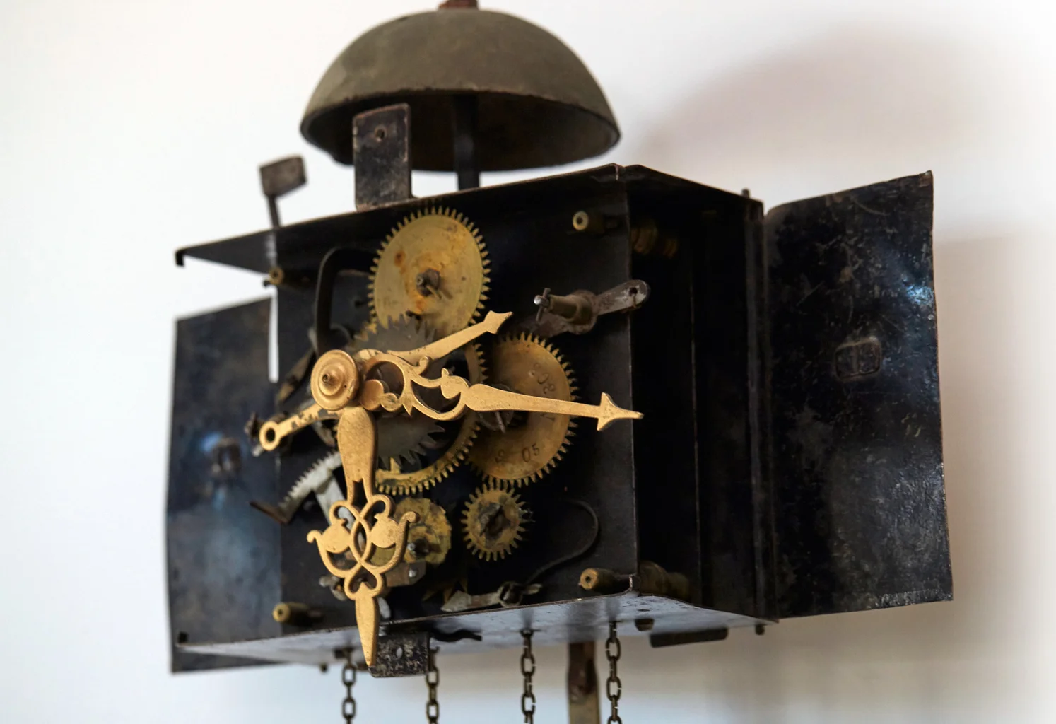 This clock displays the hour, minute, and the date. The simplicity or complexity of a clock does not necessarily indicate if a clock was made in an earlier or later period. Some clocks dating back to the 1800s are as complicated as the Shilstra Clock, whose complex mechanism is shown in the photograph above.