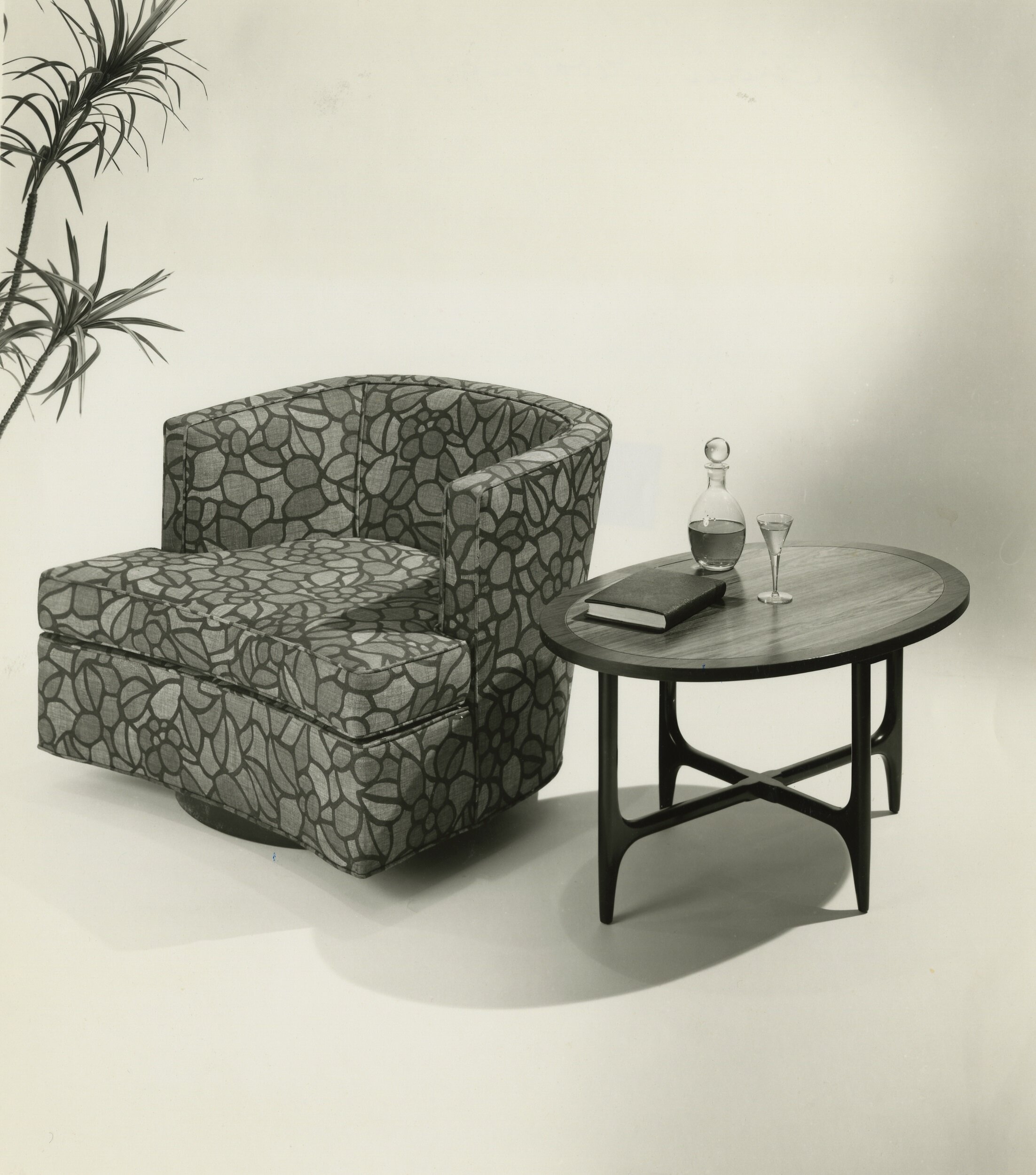 Harvey Probber round-back club chair and occasional table, c. 1960. 